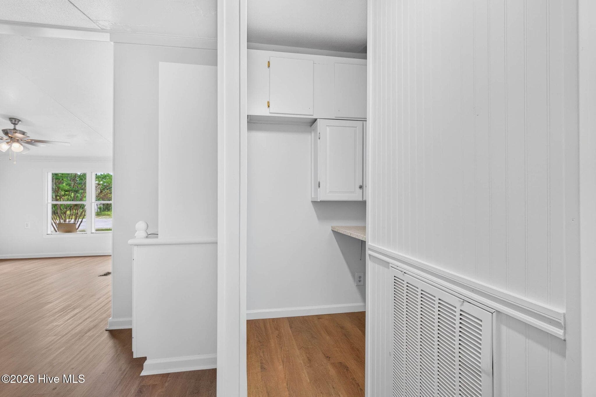 Sunny breakfast nook surrounded by windows offers the perfect spot to enjoy morning coffee while overlooking the peaceful property. - 1199 Zack Street SE, Bolivia, NC 28422