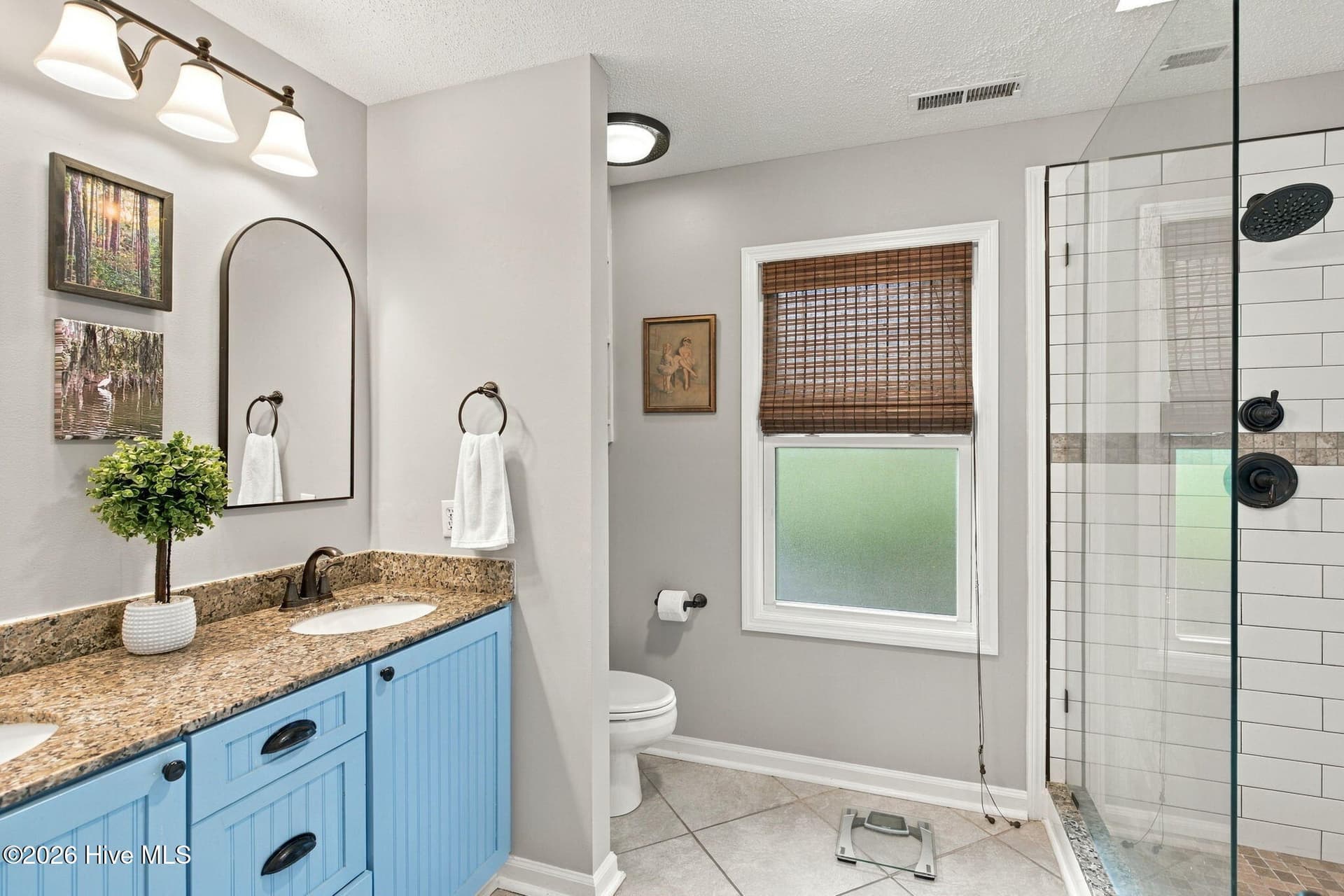 Updated master bath with dual sink and new opaque window - 3501 Kyle Court, Wilmington, NC 28409