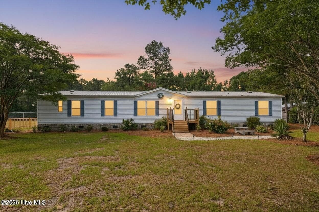 Twilight picture of 1199 Zack Street SE. - 1199 Zack Street SE, Bolivia, NC 28422