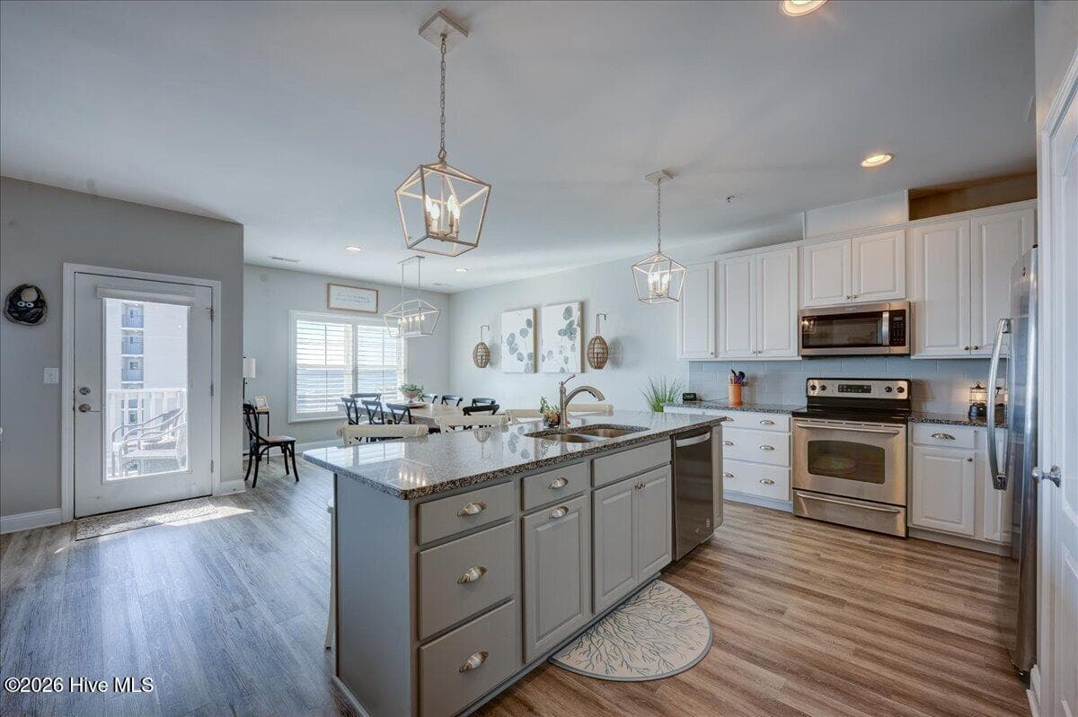 The door leads to balcony - 104 Pelican Drive H, Atlantic Beach, NC 28512