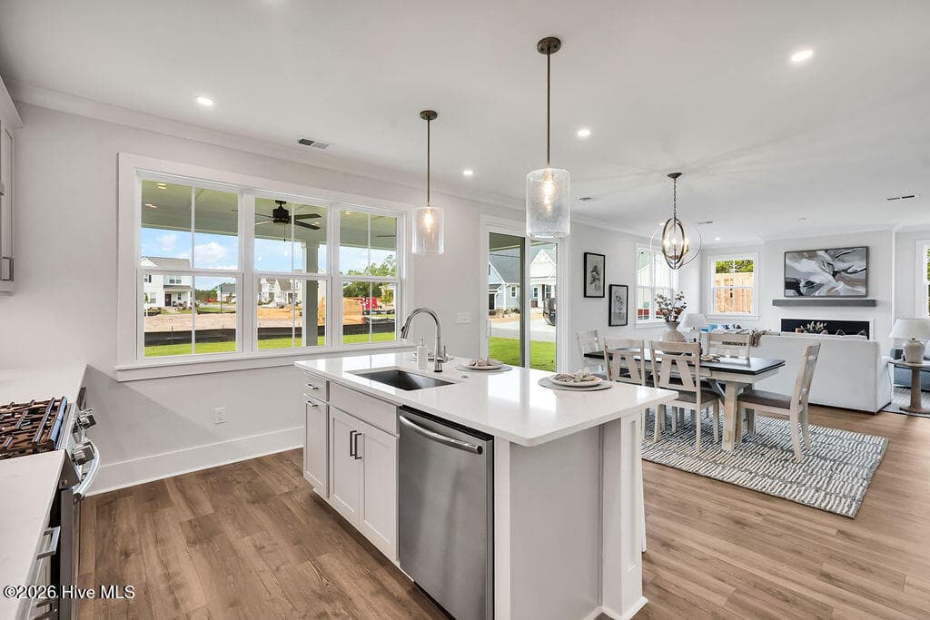 Kitchen with Stainless steel gas range, dishwasher, vent hood and microwave - 5202 Moonshell Loop, Wilmington, NC 28412