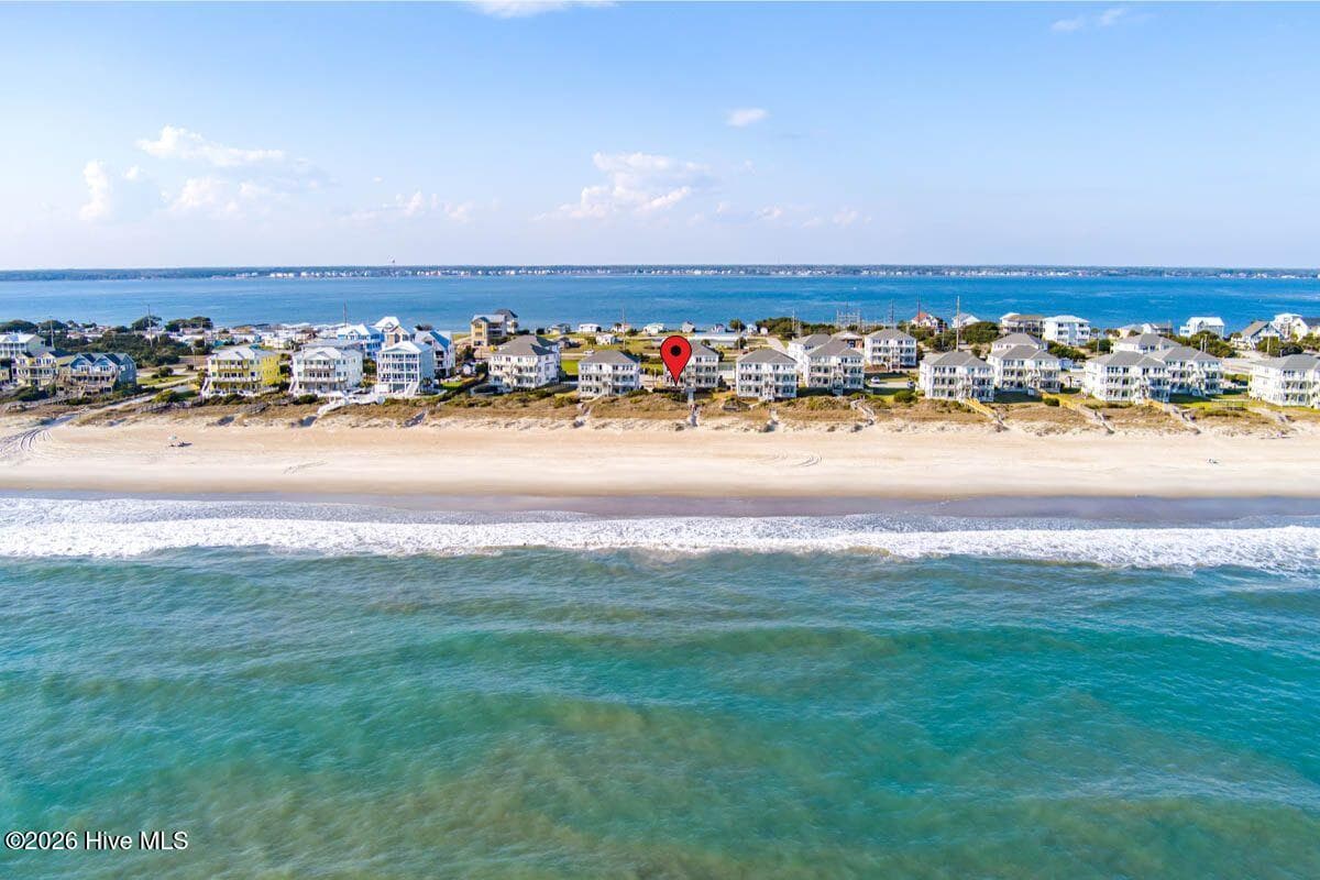 This furnished first-floor 2BR/2BA condo in Building 2909 (Unit B1) offers easy access, ocean views, strong rental history, and the rare chance for investors to purchase two side-by-side first-floor units, as neighboring unit A1 is also currently available. - 2909 Pointe West Drive 3b1, Emerald Isle, NC 28594