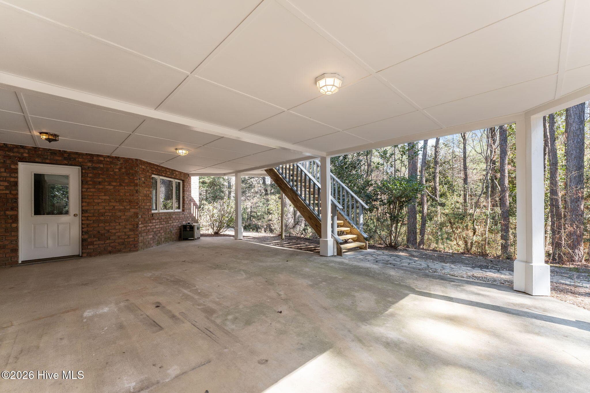 Covered patio area with access from the entertainment area and the workshop. - 22 Lochmere Drive, Pinehurst, NC 28374