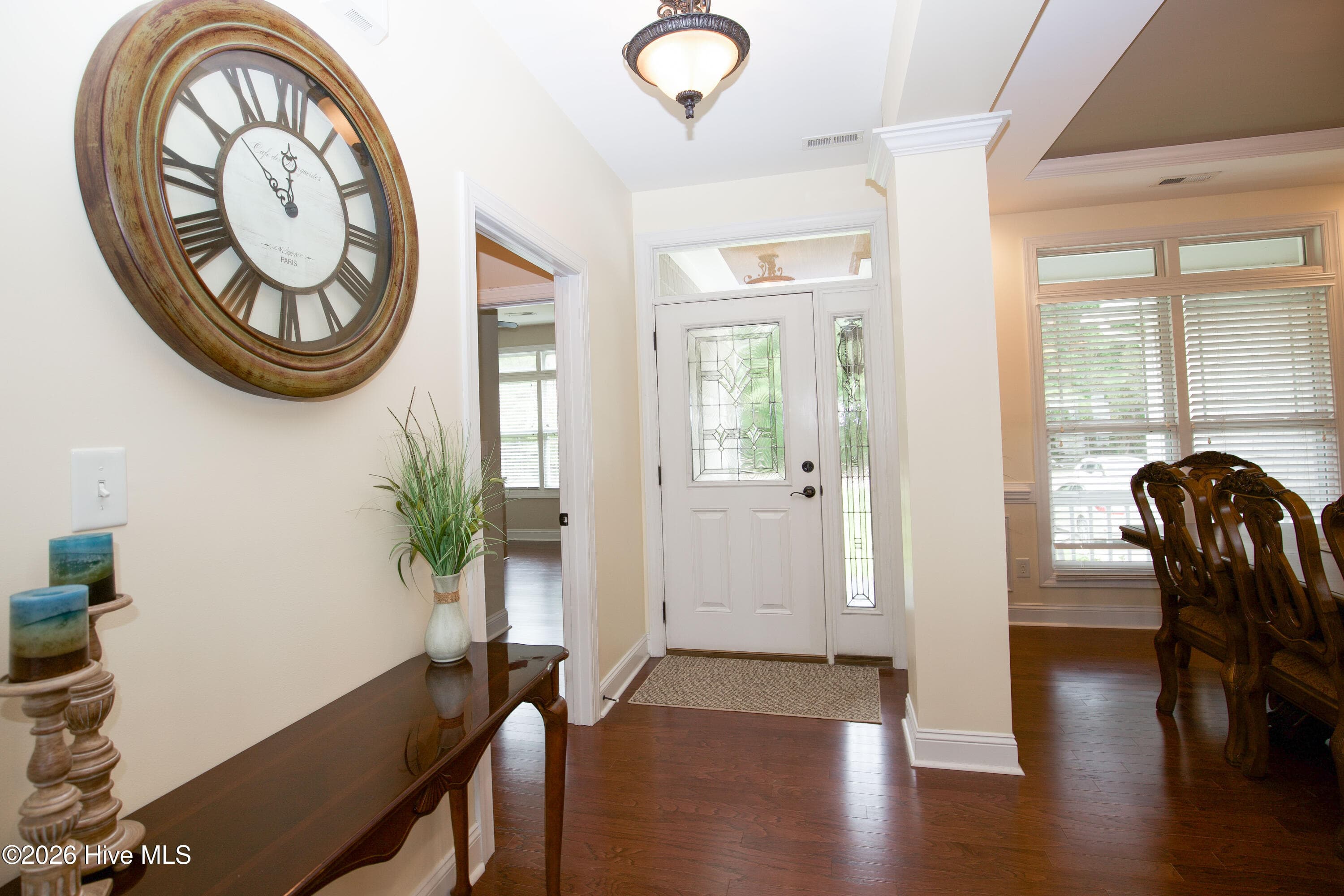 View from the foyer toward the dining room and front entry. - 899 Seagull Drive, Vass, NC 28394, Vass