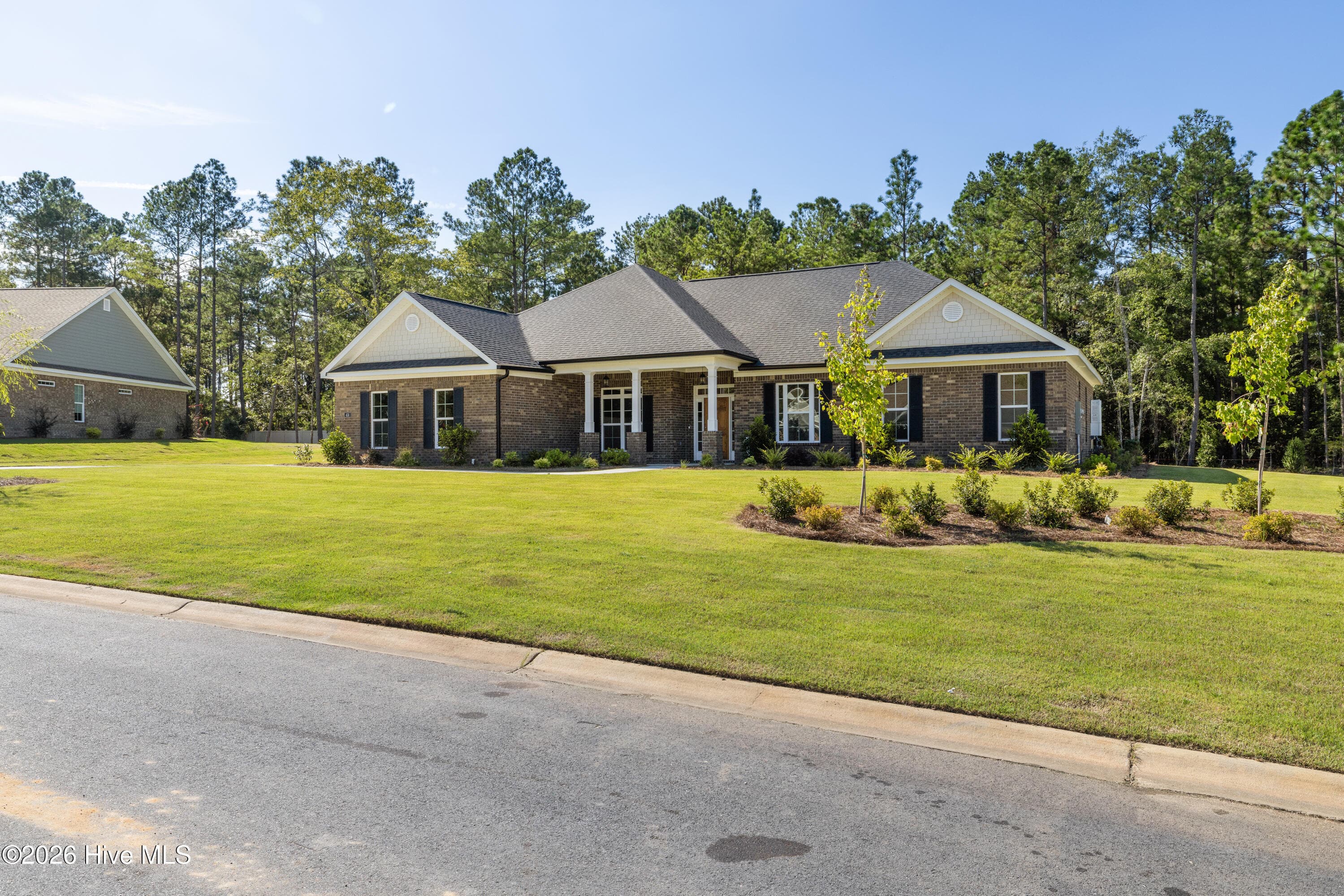 Impressive brick home surrounded by manicured landscaping - 458 Longshadow Drive, Aiken, SC 29803