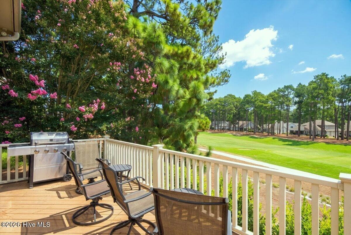Wake up to golf views! This stunning townhome features a beautiful primary suite with direct patio access overlooking the prestigious Pinehurst CC National No. 9 course. - 150 Cochrane Castle Circle, Pinehurst, NC 28374