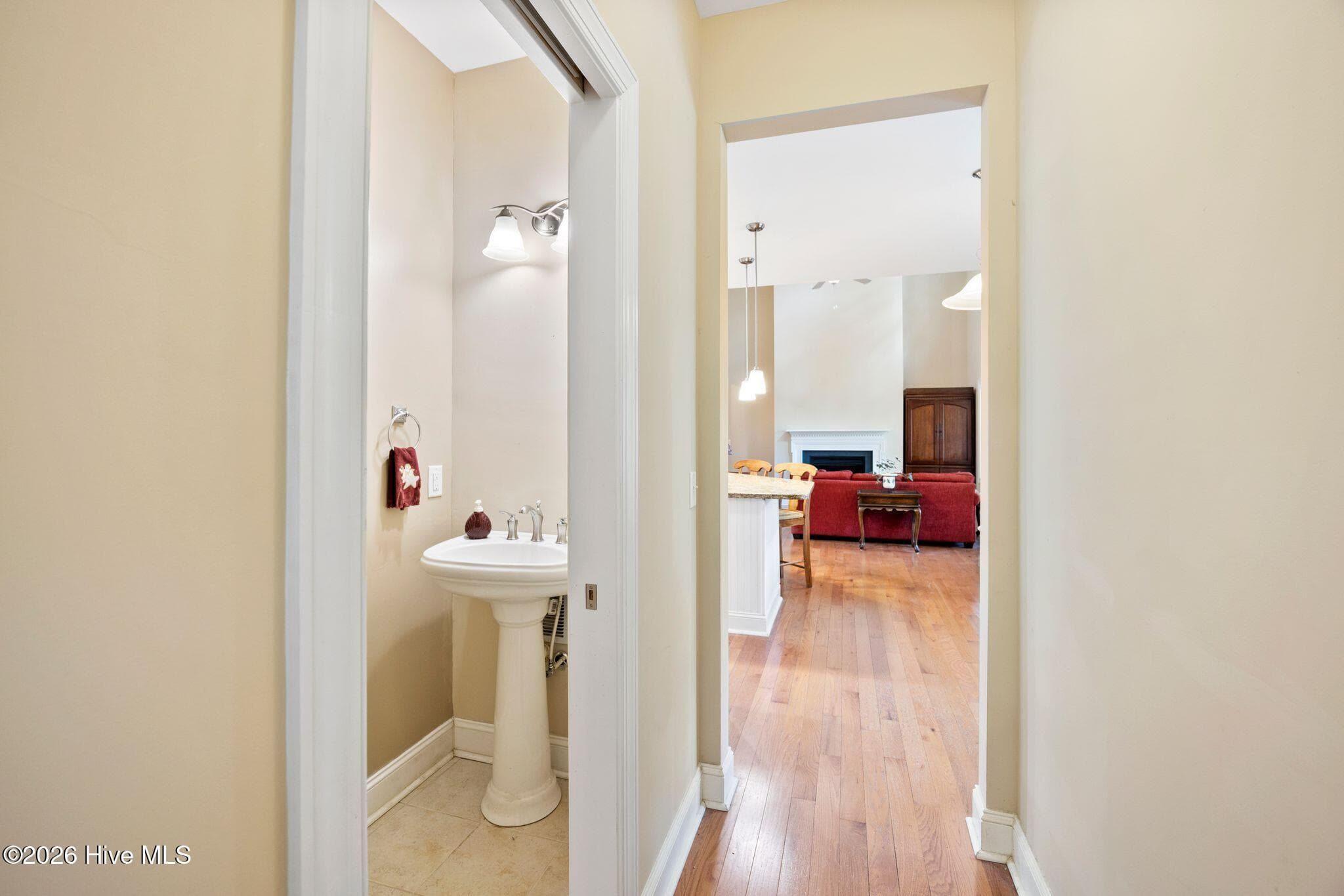 Convenient half bath located between laundry room and breakfast area. - 1620 Golfers Ridge Drive SE, Bolivia, NC 28422