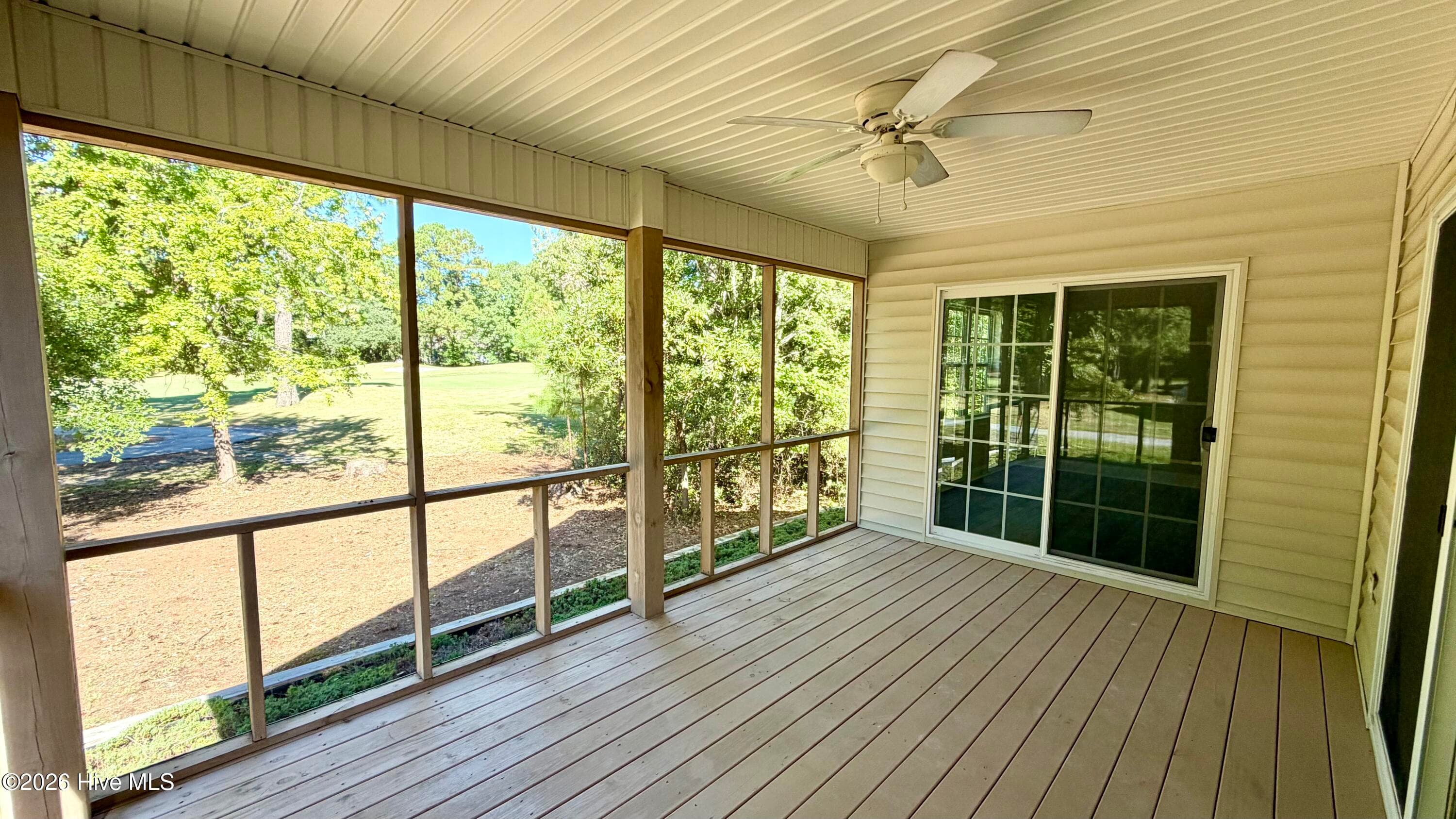 This will be your space to sit back, relax, and enjoy watching the golfers on the putting green! - 1114 Barkentine Drive, New Bern, NC 28560
