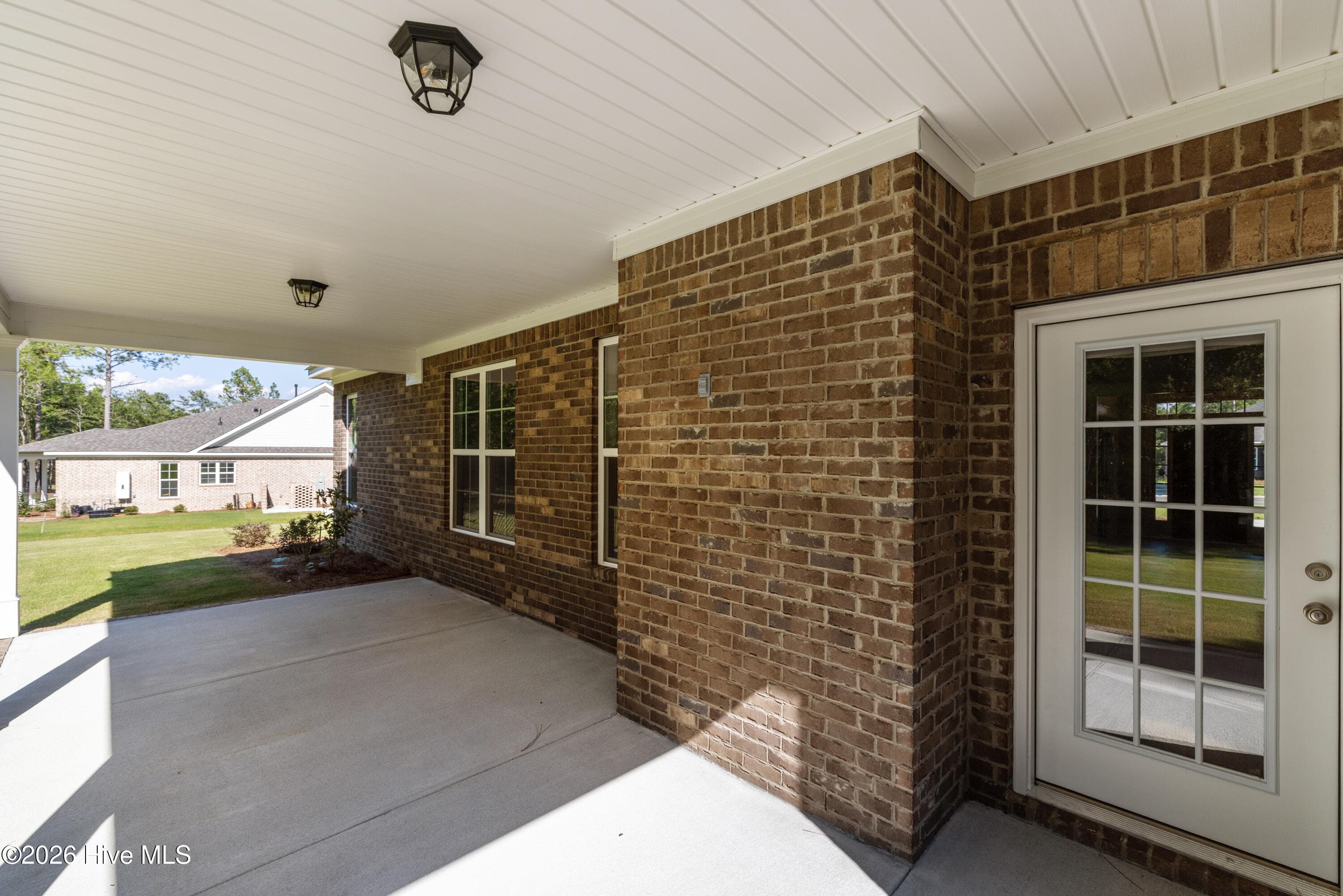 Beautiful rear exterior with an expansive covered porch - 458 Longshadow Drive, Aiken, SC 29803