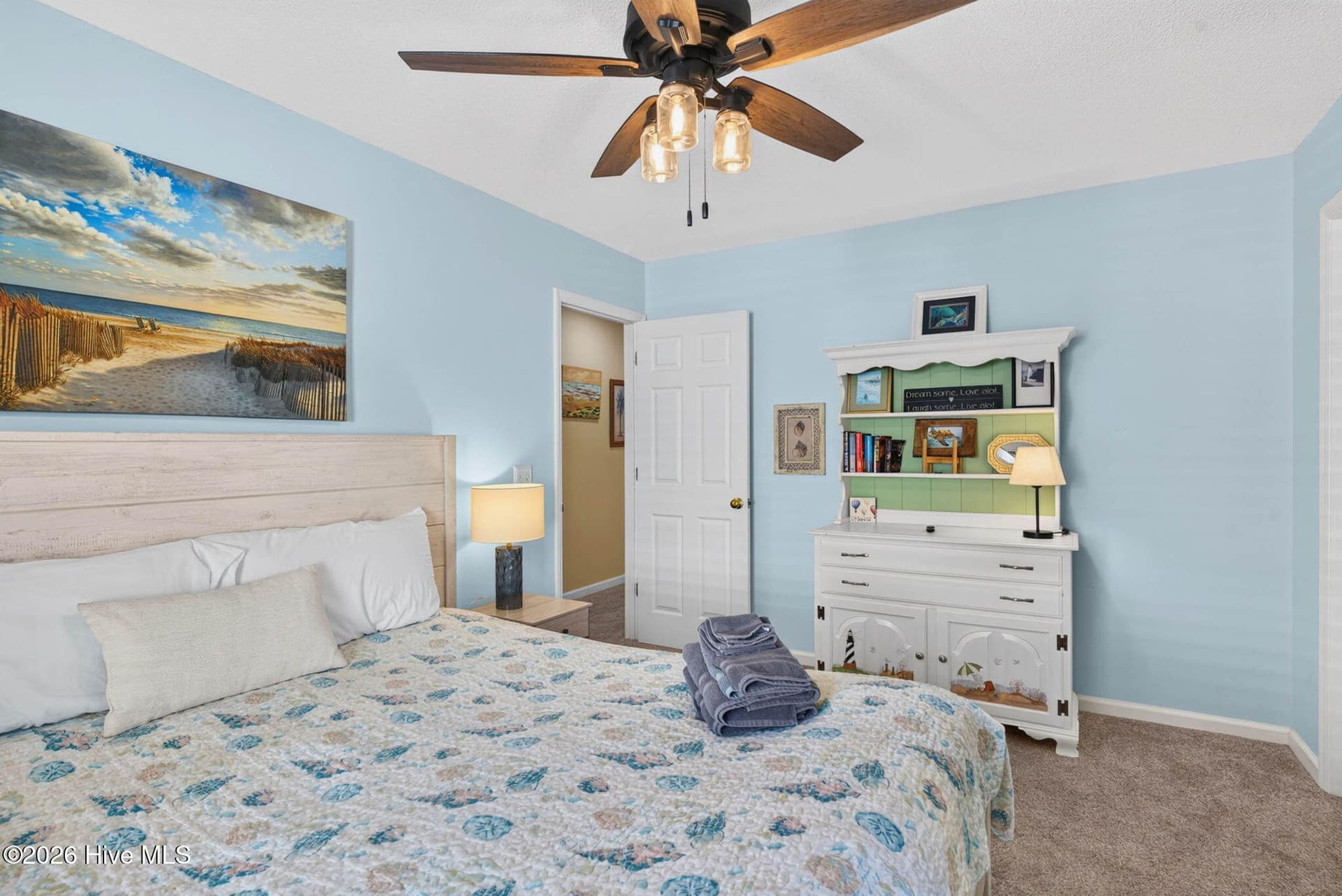 Another view of the spacious primary bedroom, with room for additional furniture and storage. - 1650 Frink Street SW, Ocean Isle Beach, NC 28469