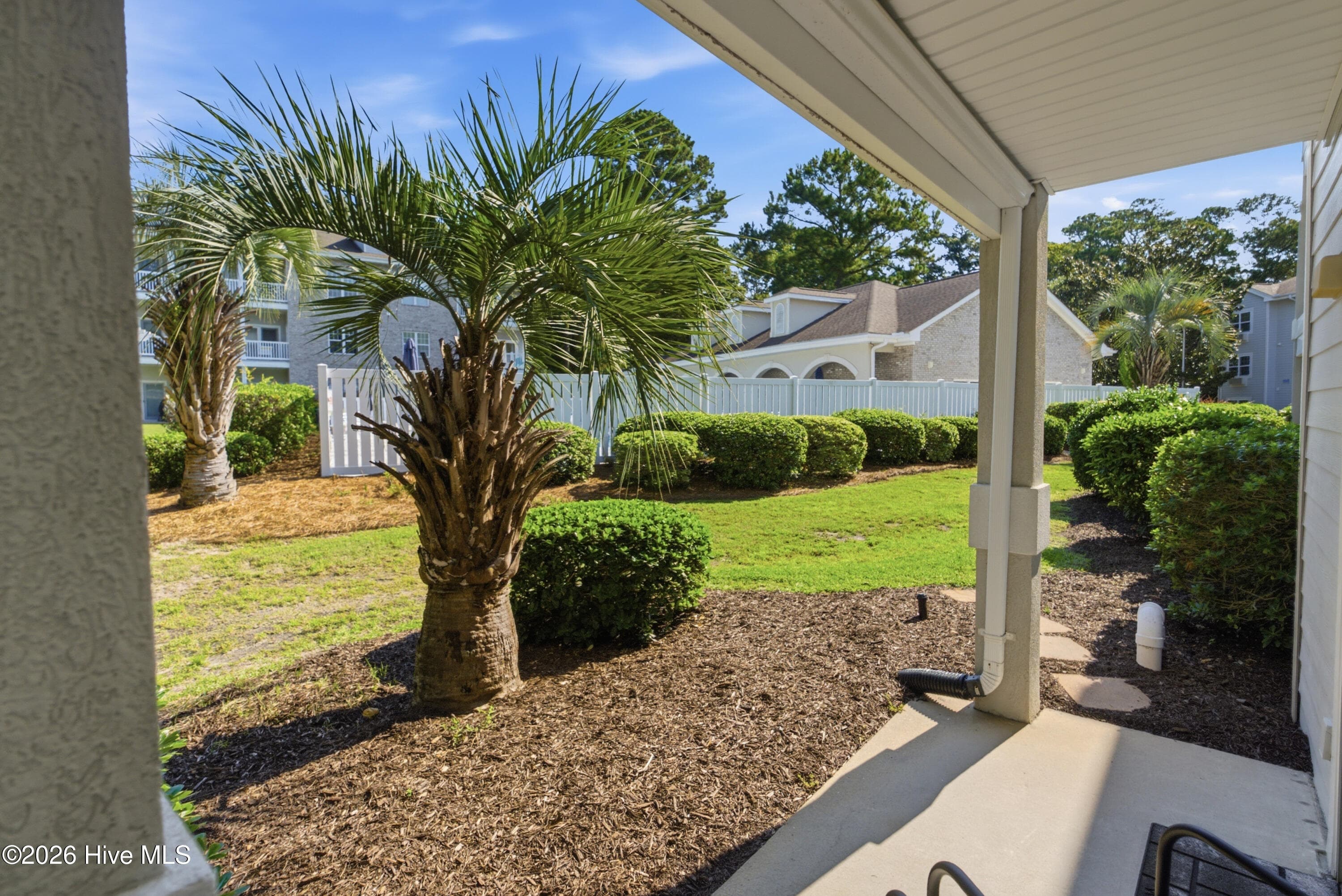 Covered patio view - 908 Resort Circle Unit 203, Sunset Beach, NC 28468