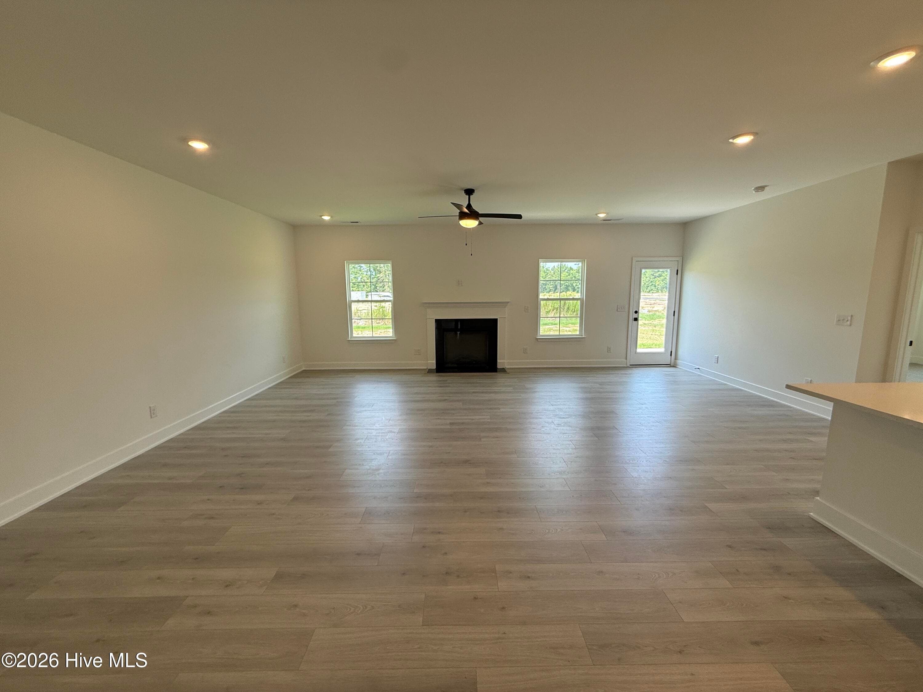 Representative photo Family Room with electric fireplace and kitchen - 2129 Sandbrook Loop, Leland, NC 28451