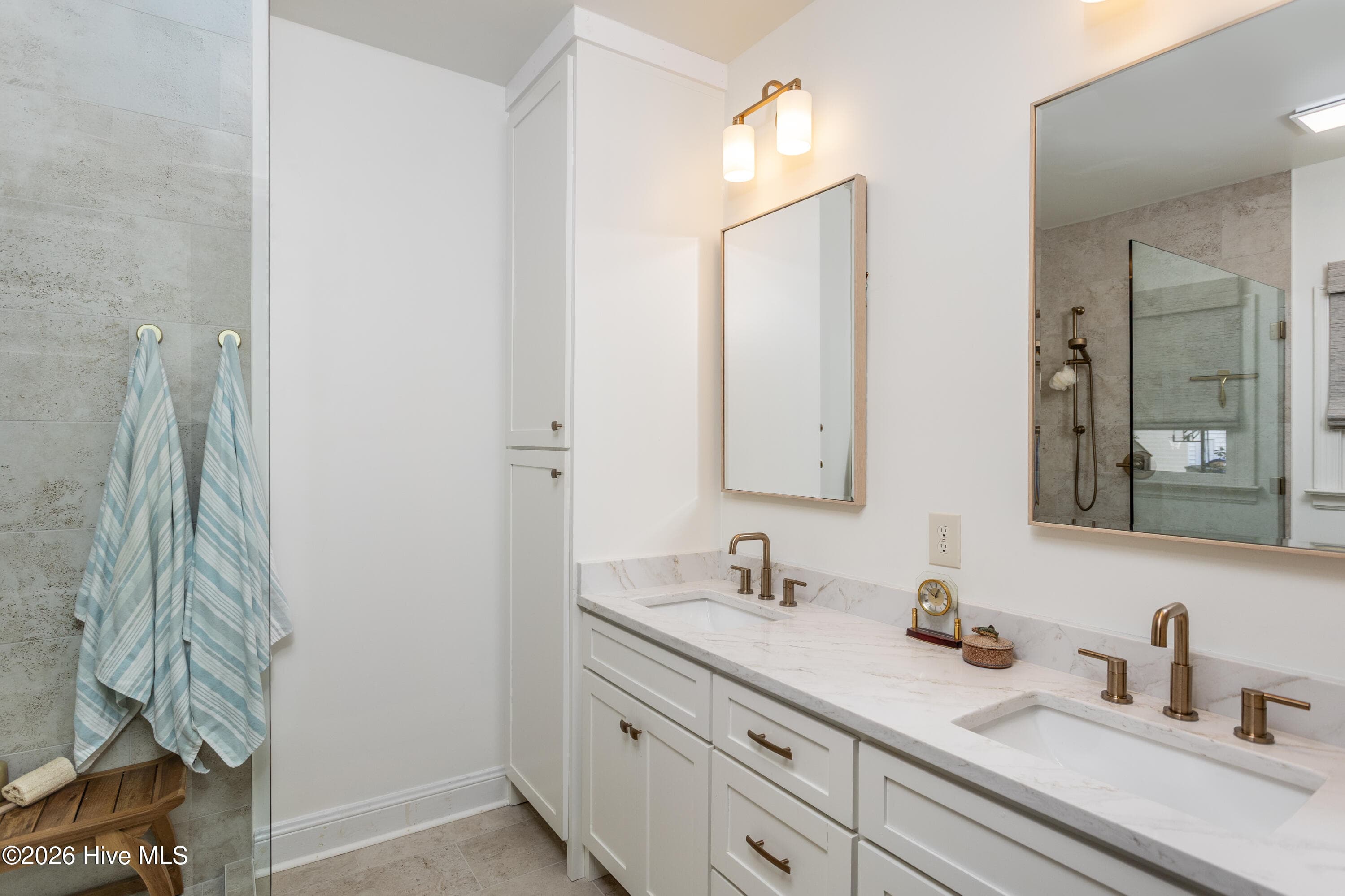 Double sink custom vanity and storage tower in primary - 5050 Country Club Drive N, Wilson, NC 27896