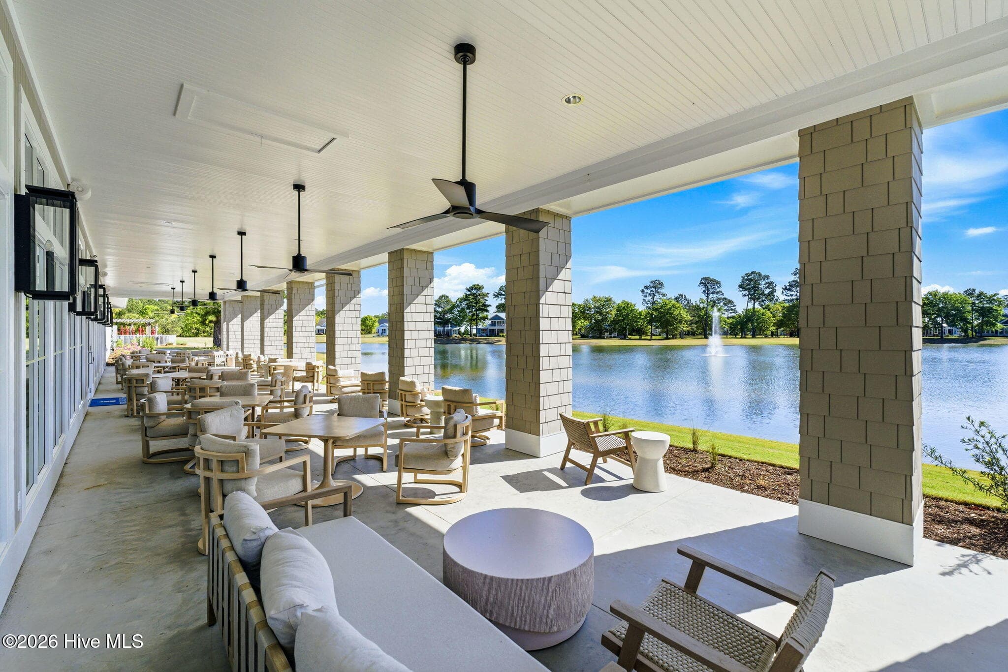 Outdoor seating at the clubhouse. - 3784 Crab Catcher Loop NE, Leland, NC 28451