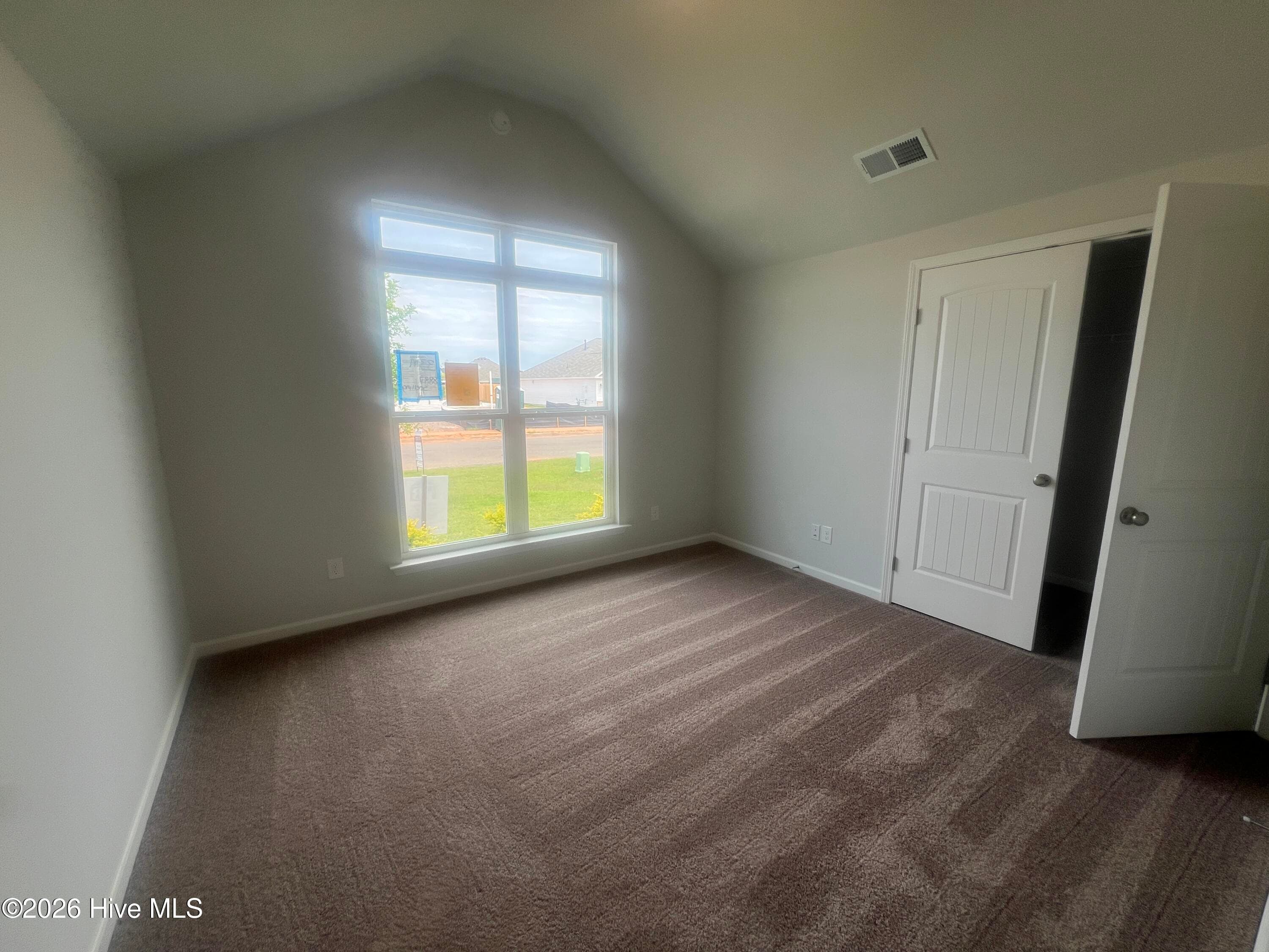 3rd. bedroom with vaulted ceiling. Tons of natural light from that pretty window. - 8887 Snelling Drive, Aiken, SC 29803