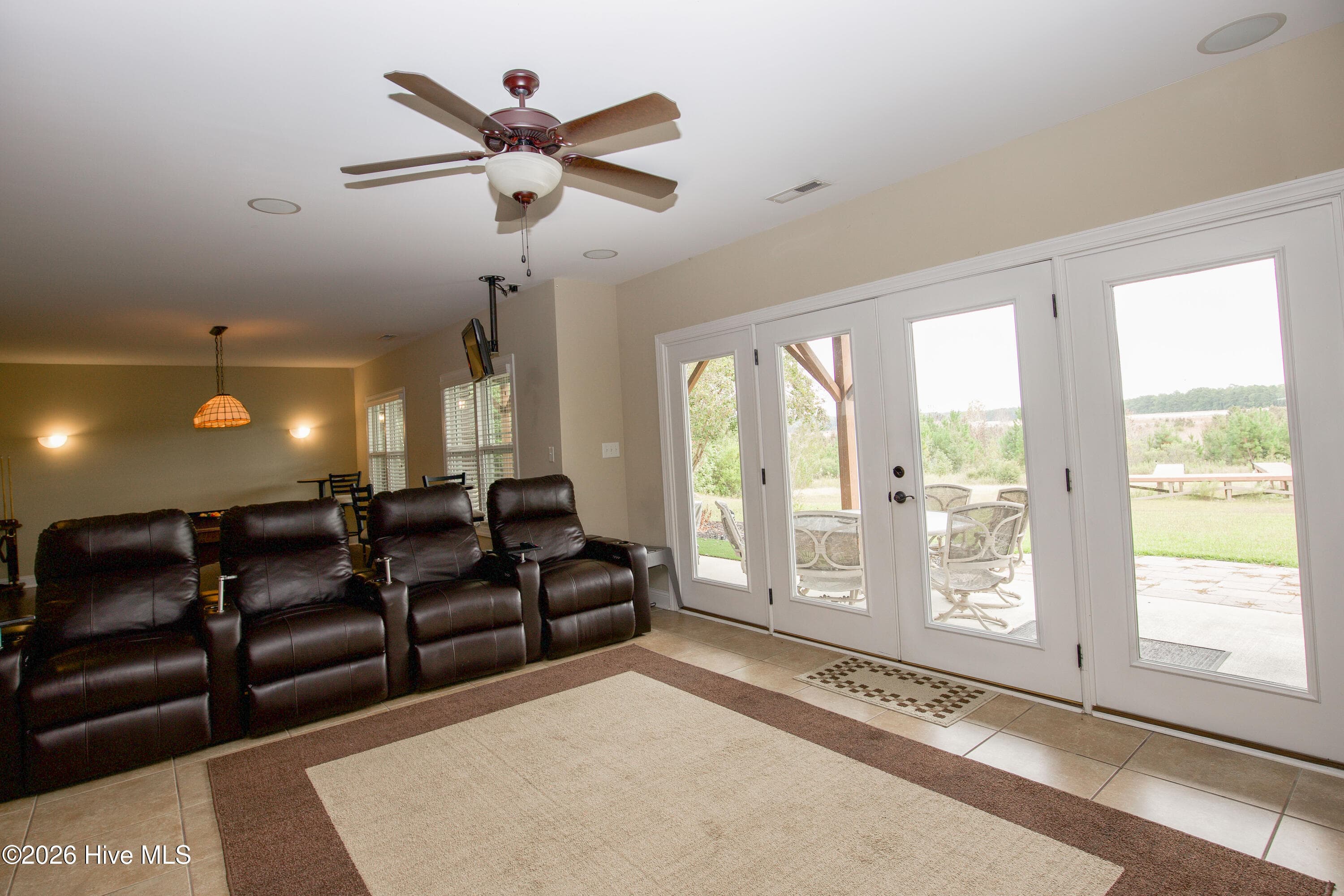 Media area with direct walkout access to the covered patio. - 899 Seagull Drive, Vass, NC 28394, Vass