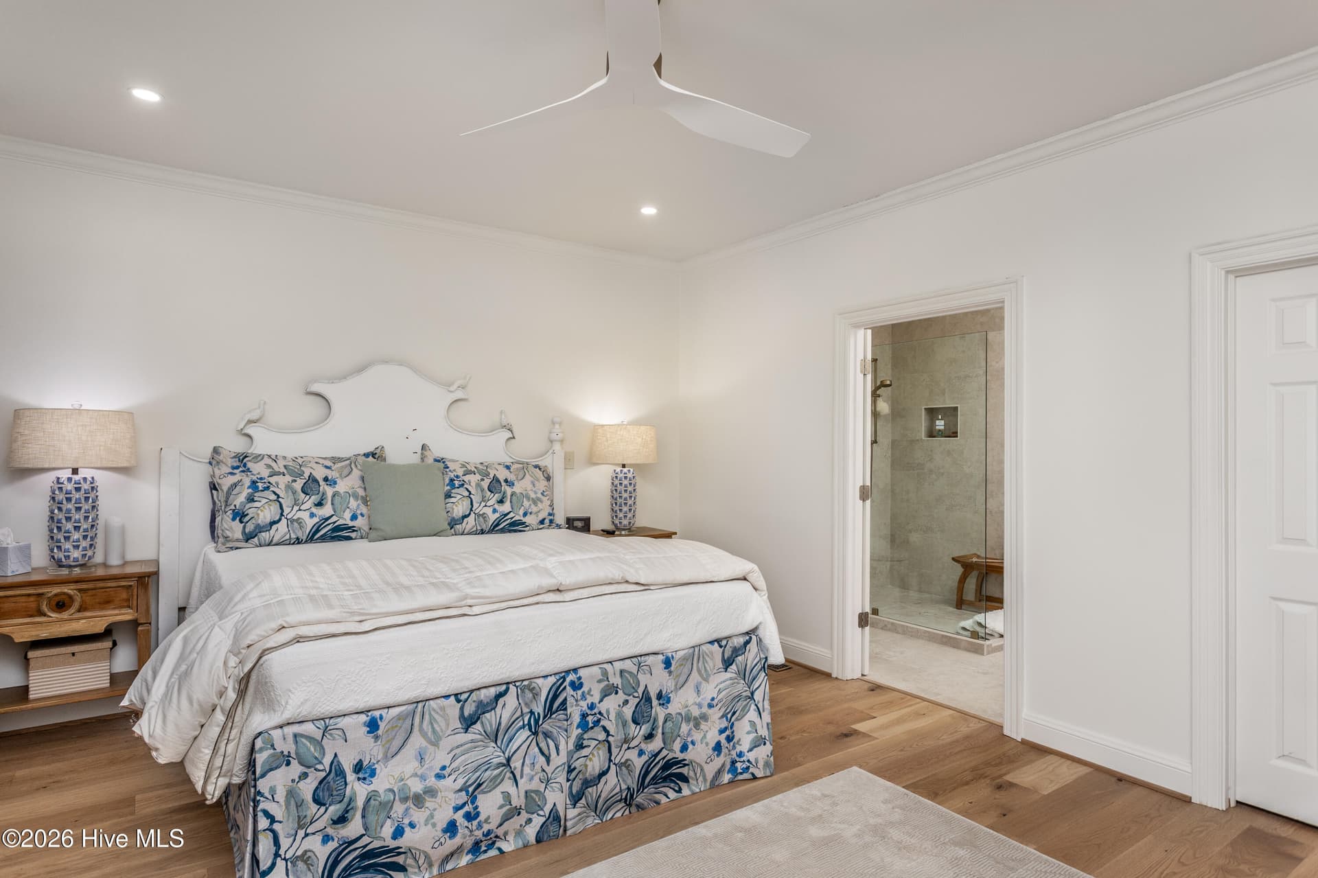 Large primary bedroom with adjacent primary spa-feel bath. - 5050 Country Club Drive N, Wilson, NC 27896