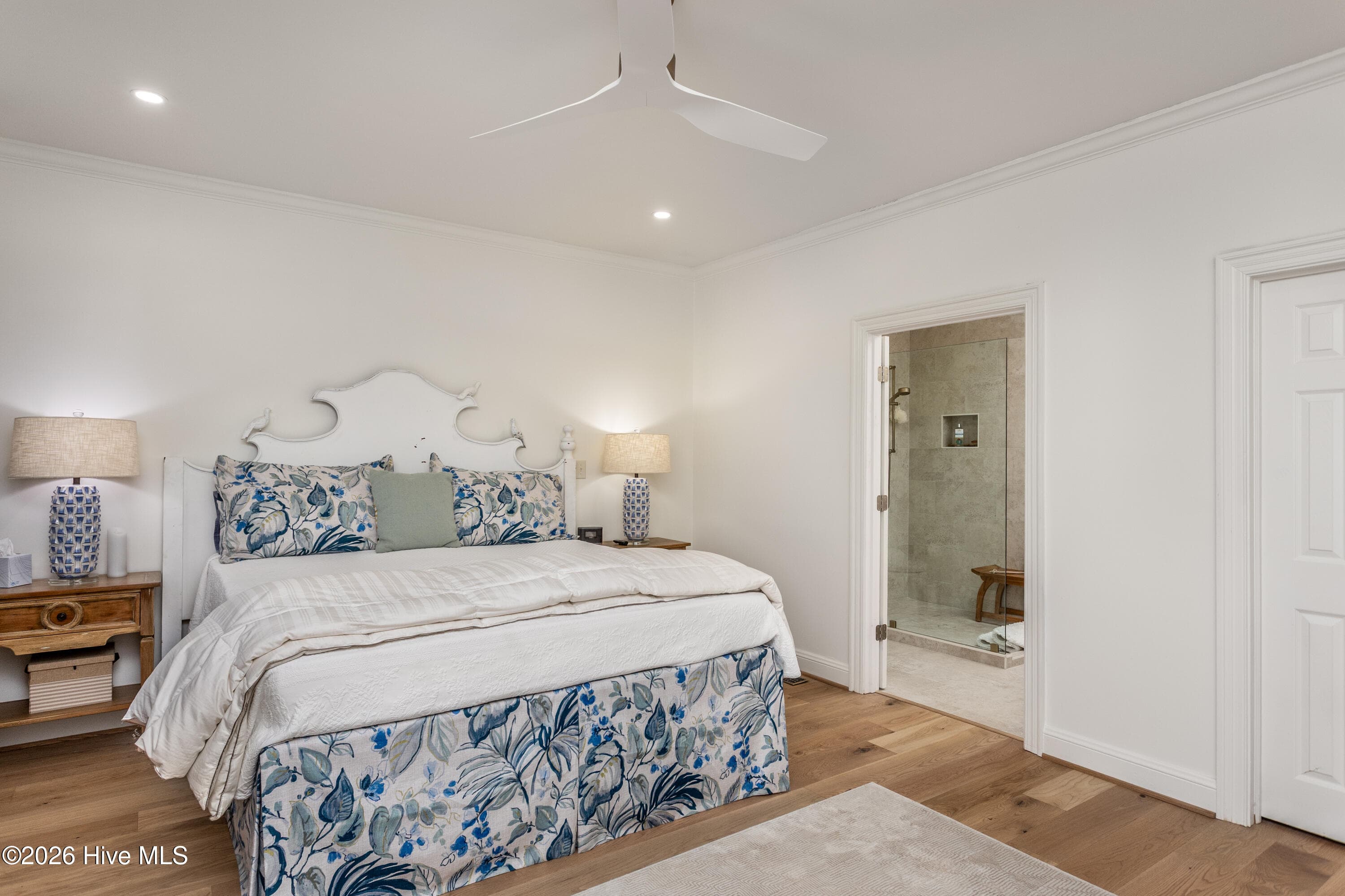 Large primary bedroom with adjacent primary spa-feel bath. - 5050 Country Club Drive N, Wilson, NC 27896