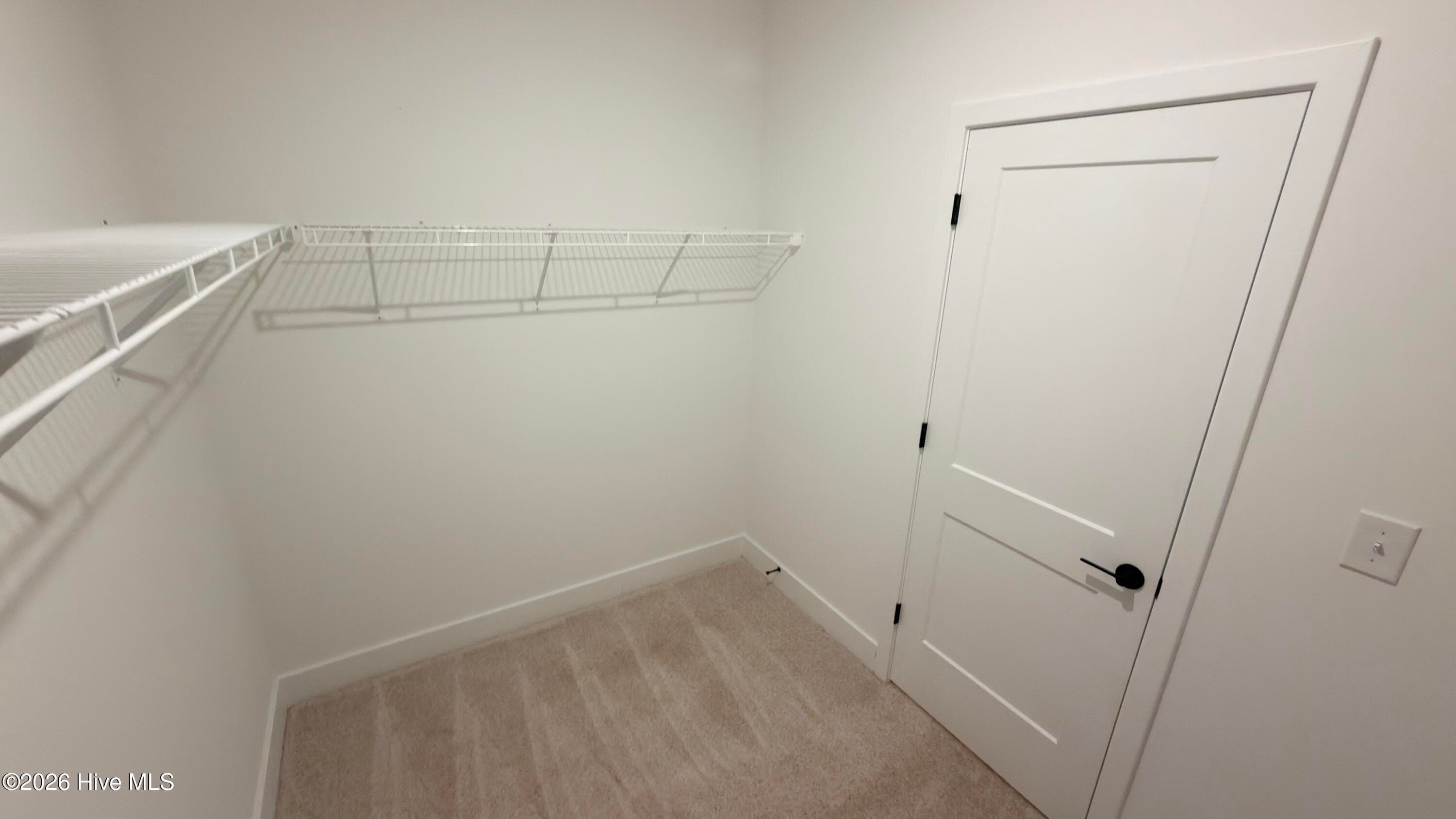 Primary walk in closet - 2129 Sandbrook Loop, Leland, NC 28451