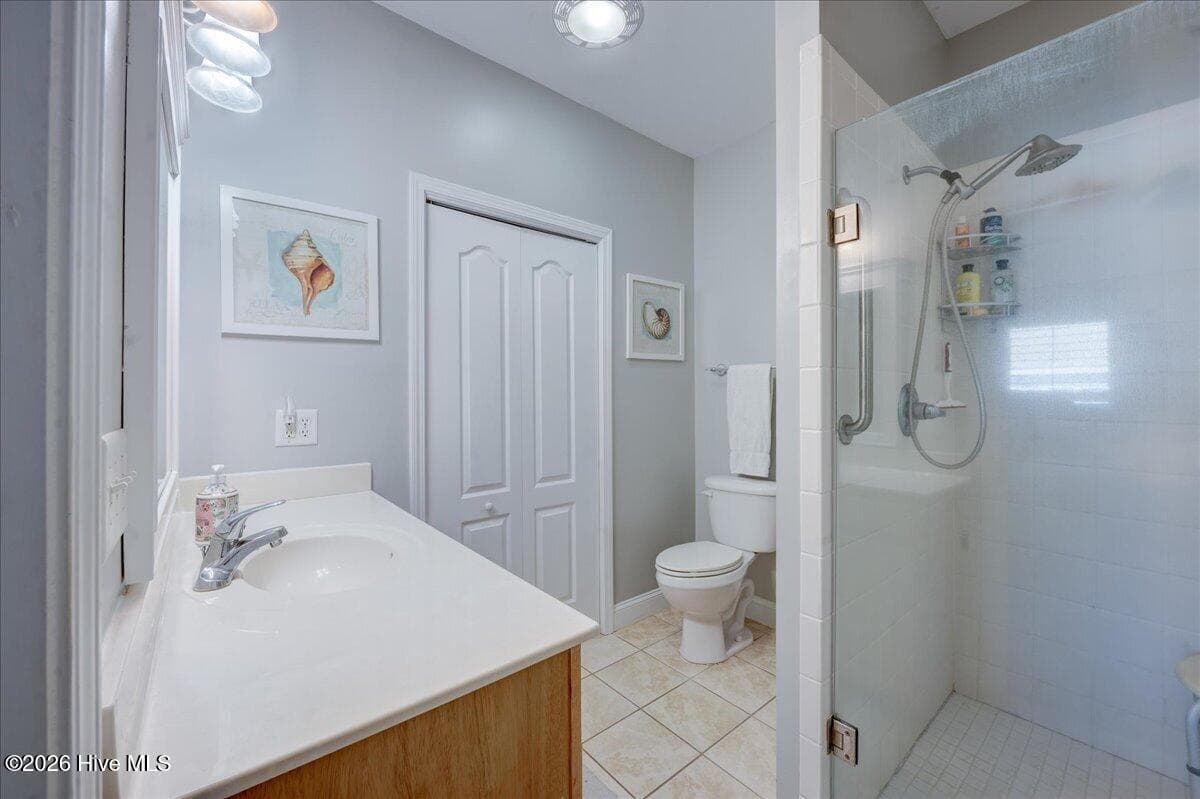 Primary Bath with walk in shower and large closet - 104 Pelican Drive H, Atlantic Beach, NC 28512