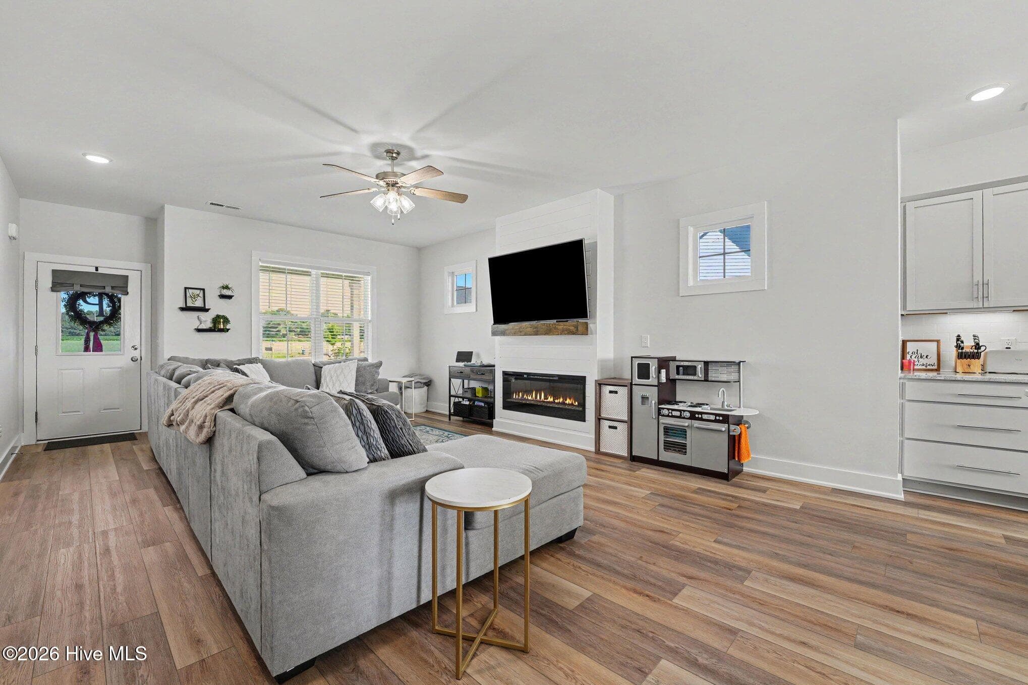 Living room with fireplace and entry - 176 Glenwood Place, Kenly, NC 27542