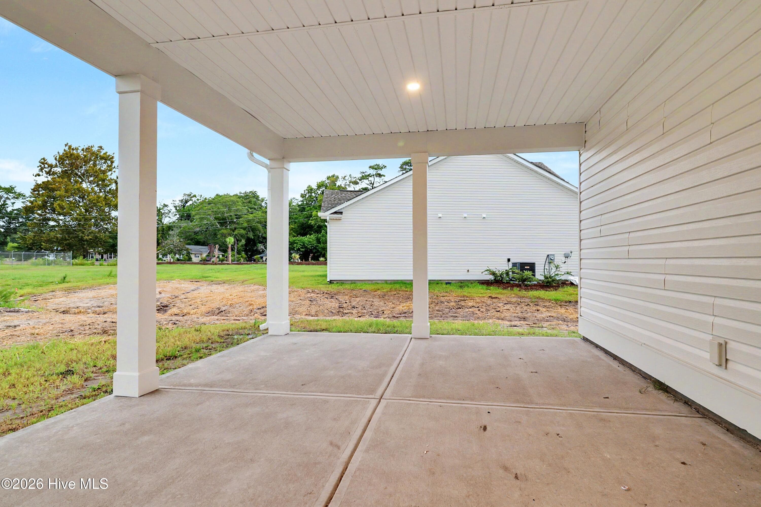 Large covered patio with direct views of 10th hole at The Links at Brick Landing - 2114 Cregan Cove SW (Lot 3), Ocean Isle Beach, NC 28469