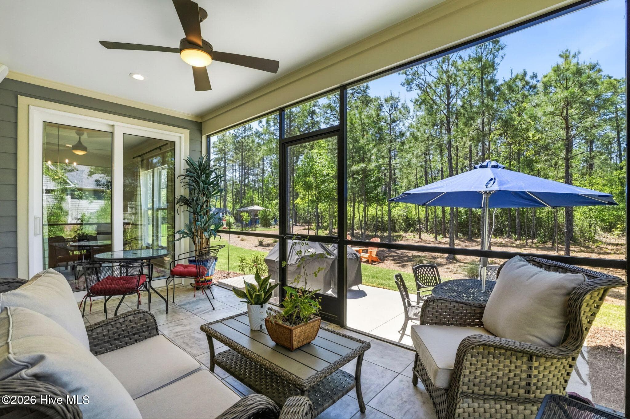 Covered and screened back porch with cement patio. - 3710 Friendly Orange Court NE, Leland, NC 28451