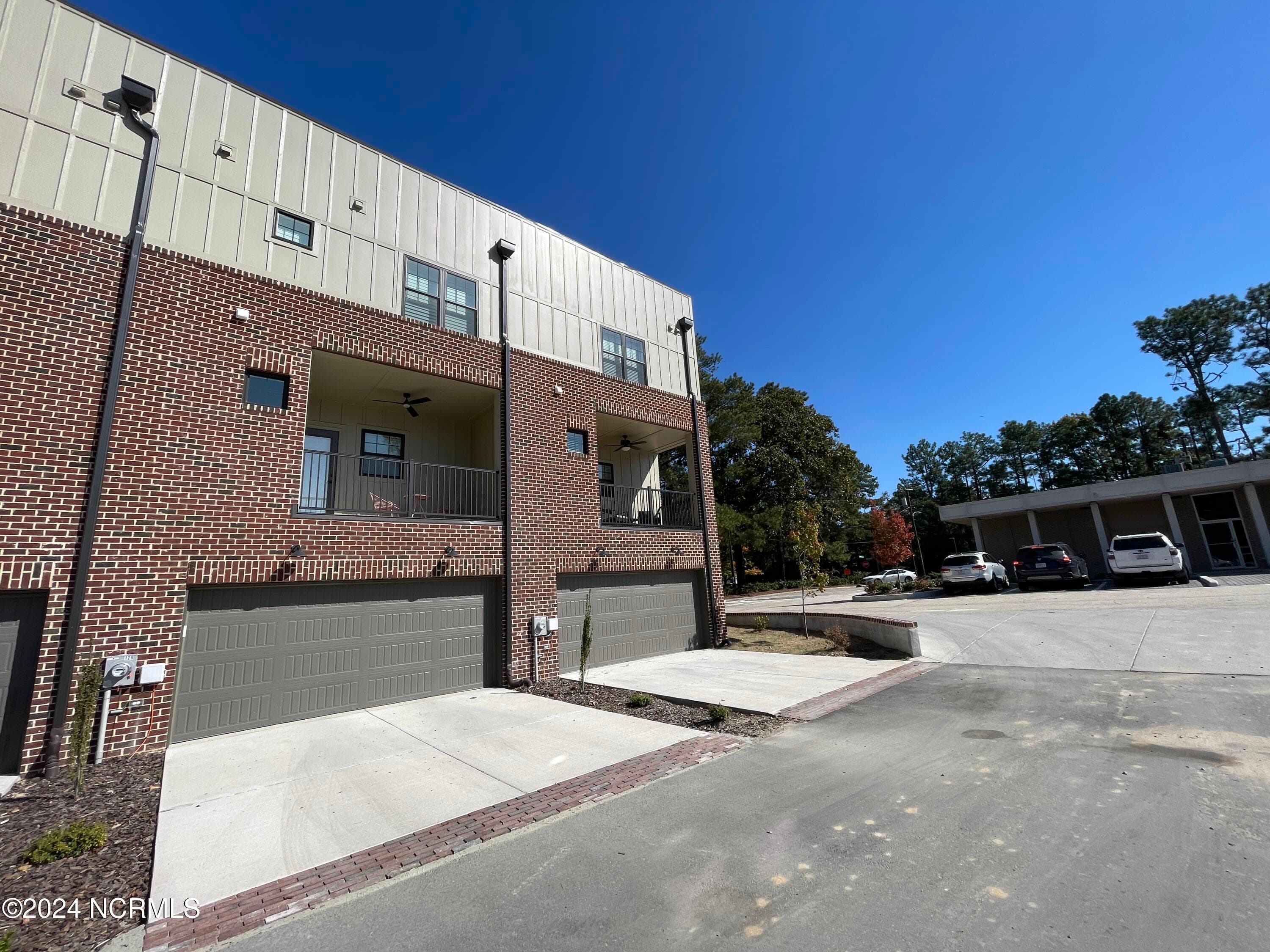 View of garage entrance in back of building - 129 Lexington Lane, Southern Pines, NC 28387
