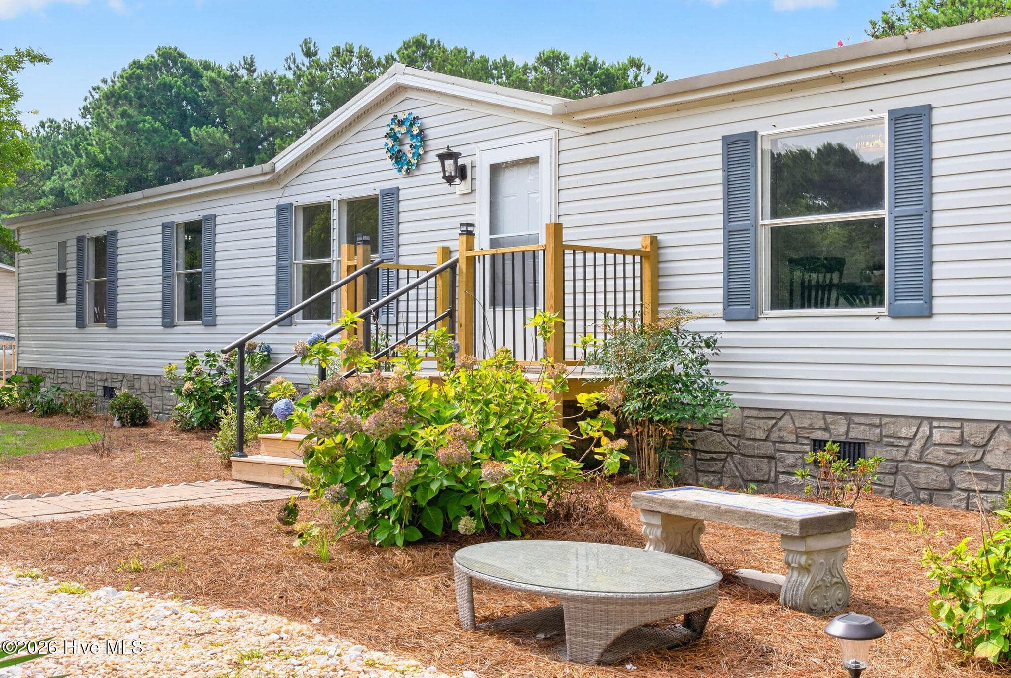 Enjoy the privacy and space of this expansive homesite featuring mature landscaping, a large front yard, and a peaceful setting in Bolivia, NC. - 1199 Zack Street SE, Bolivia, NC 28422