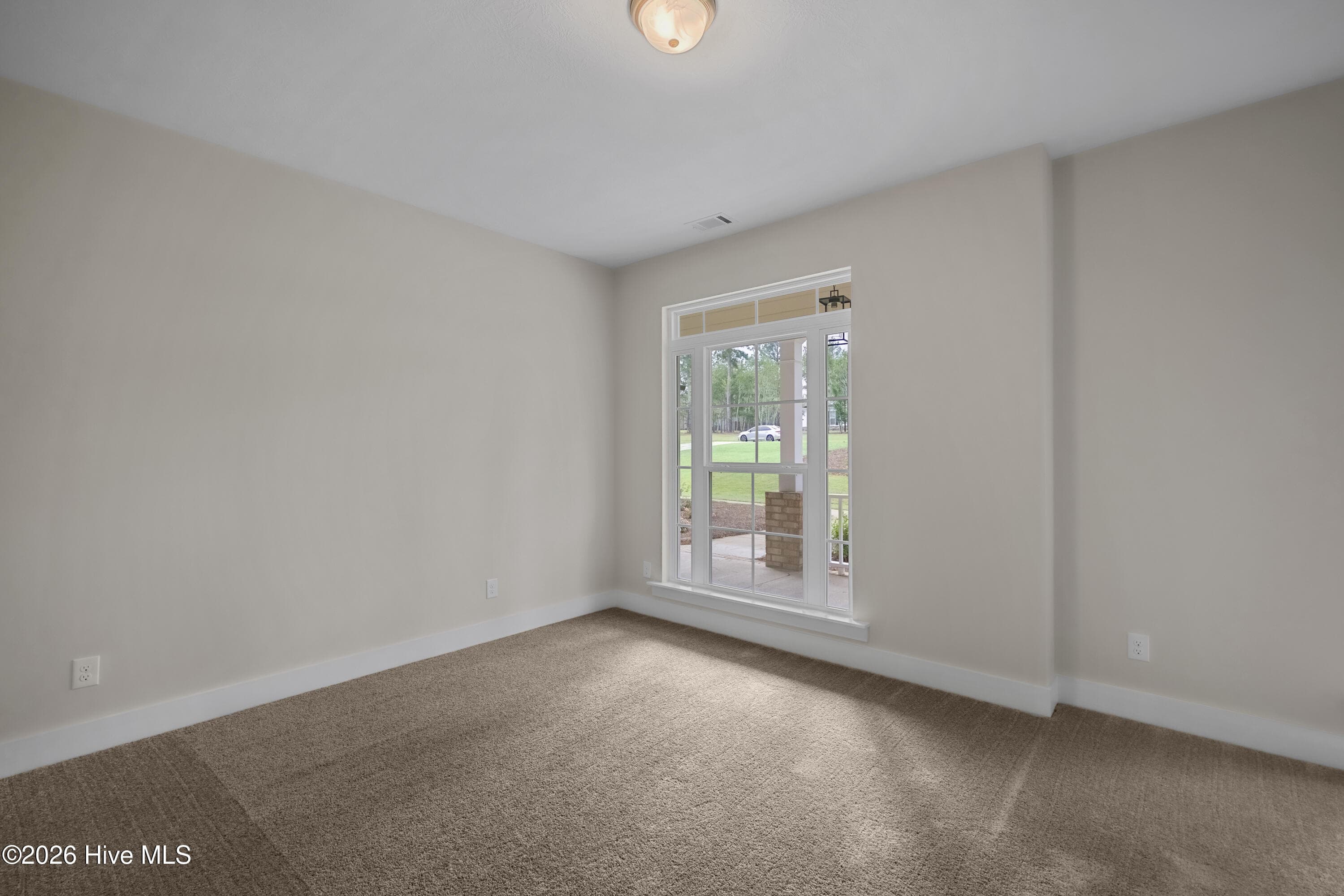 Bedroom 2 with a front porch view - 1200 Bellingham Drive, Beech Island, SC 29842