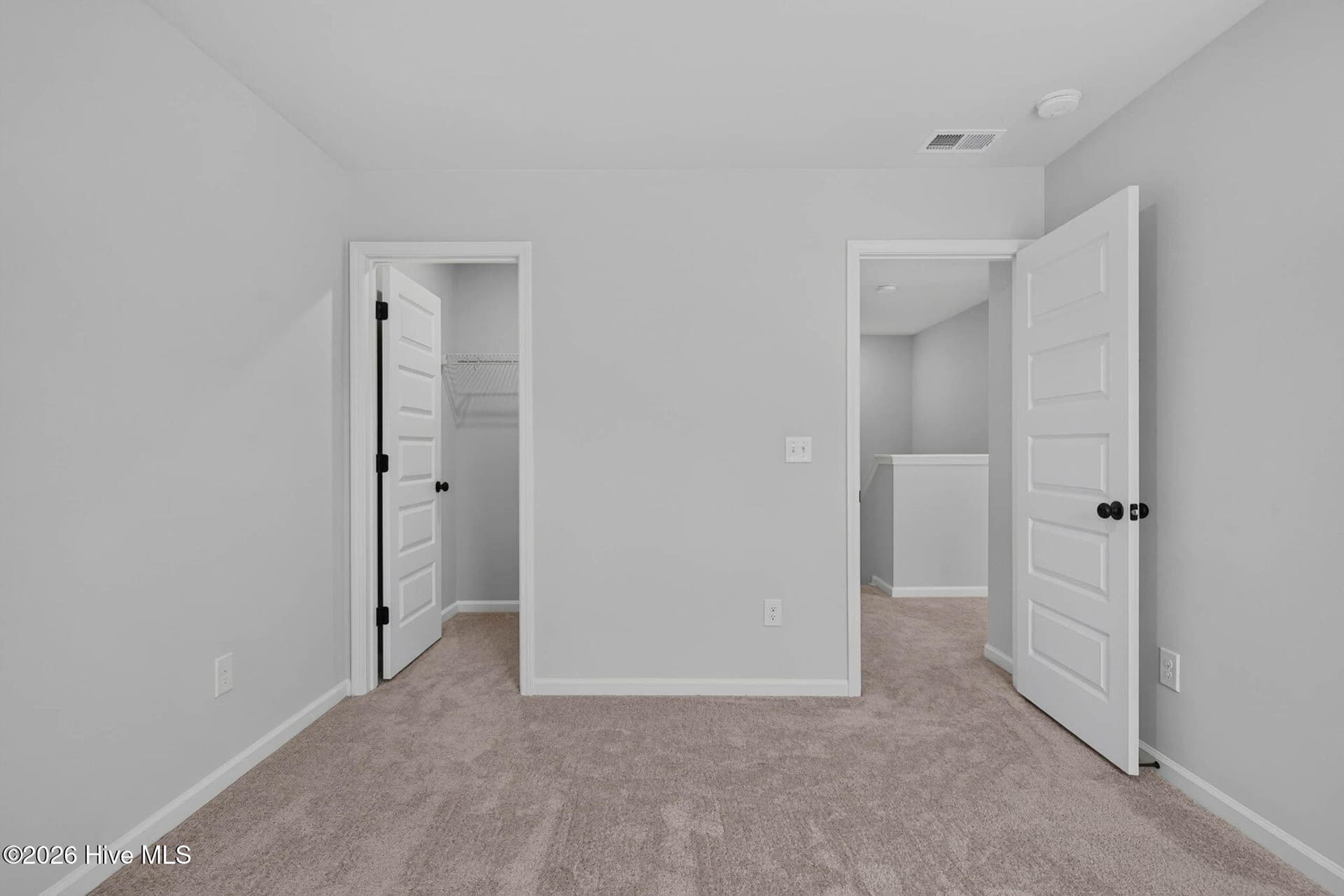 Additional upstairs bedroom offering flexible space for guests, hobbies, or a home office. - 3447 Sandhill Crane Drive SW, Ocean Isle Beach, NC 28469