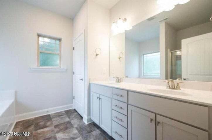 Only $1000 down and financial incentives offered with use of a preferred lender. Photos are of the same floor plan in a different community and are for layout purposes only. Upgrades, colors and finishes may differ. *This home is still under construction* - 174 Seashore Street, Grimesland, NC 27837