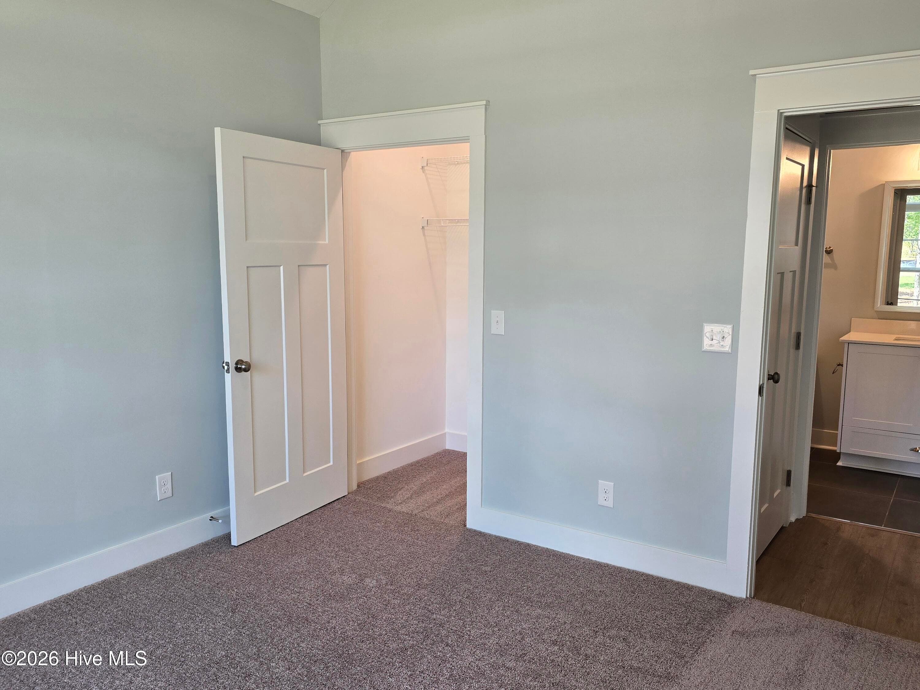 Front bedroom with walk in closet and nearby full bath - 1777 Bellingham Drive, Beech Island, SC 29842