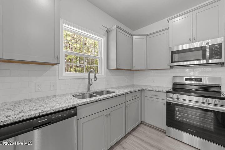 *Only $1000 down and financial incentives offered with use of a preferred lender! Home is currently under construction. Photos are of the same floor plan in a different community and are for layout purposes only. Upgrades, colors and finishes may differ. - 202 Eliza Way, Winterville, NC 28590