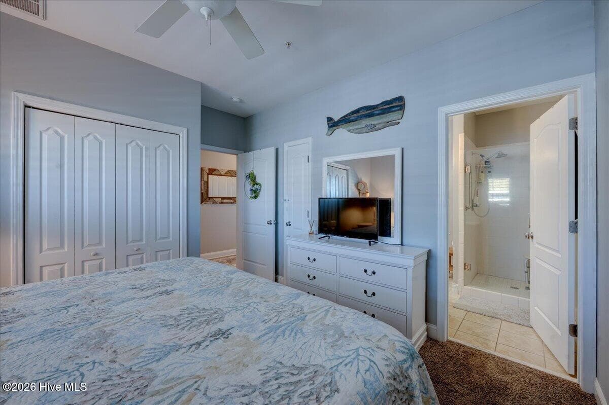Primary bathroom on the right - 104 Pelican Drive H, Atlantic Beach, NC 28512