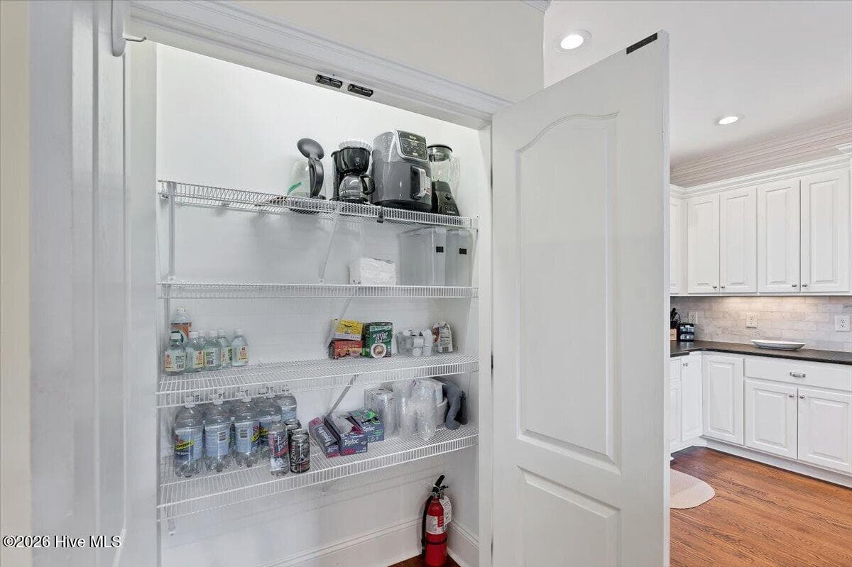 Perfectly sized Pantry to keep daily essentials organized & rest of kitchen clutter-free - 150 Cochrane Castle Circle, Pinehurst, NC 28374
