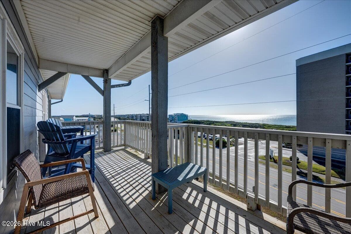 Walk out from the living area to this deck with views of the ocean! - 104 Pelican Drive H, Atlantic Beach, NC 28512