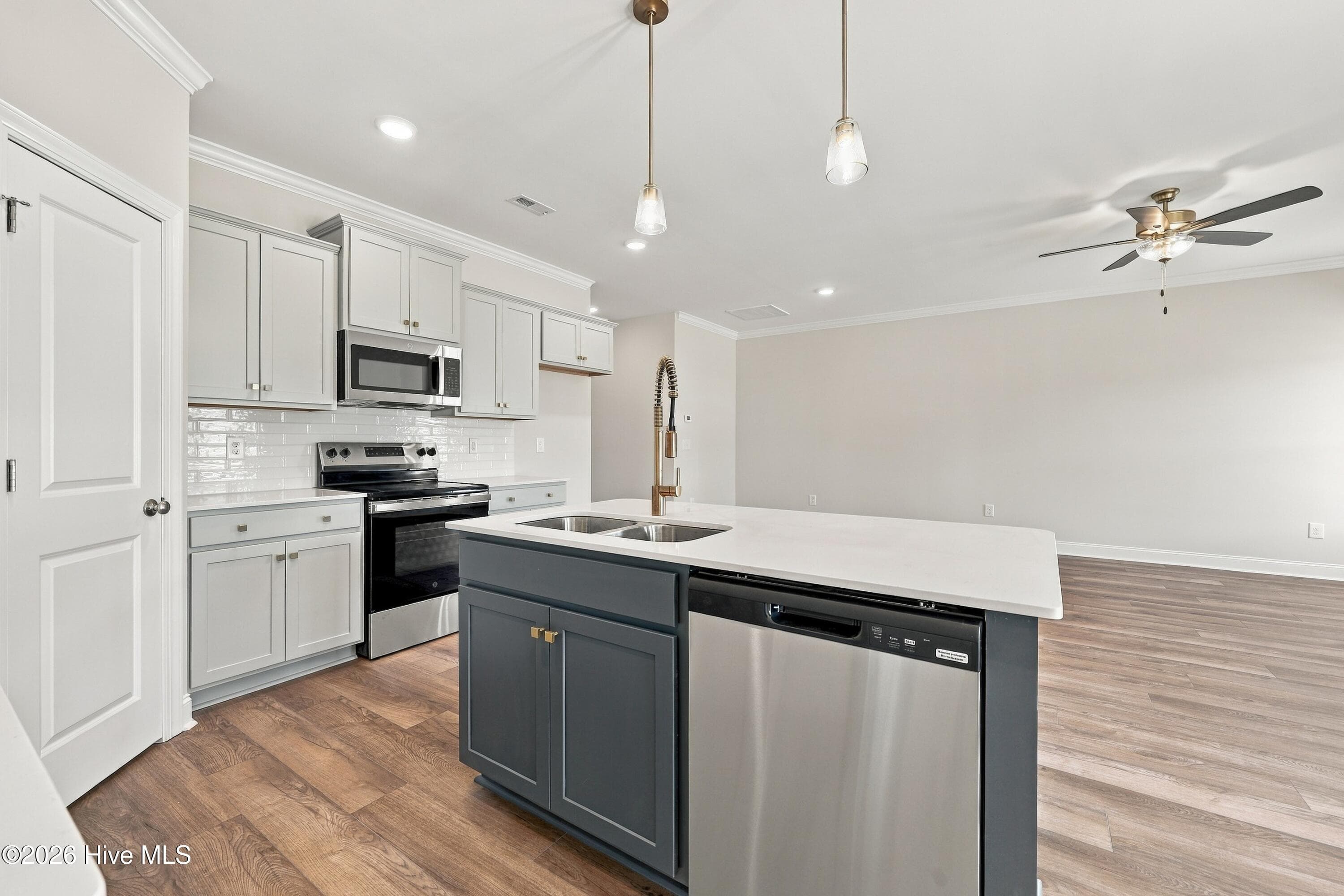 kitchen island with gold fixtures and hardware, very high end look ! - 3229 Meadow Drive, Farmville, NC 27828