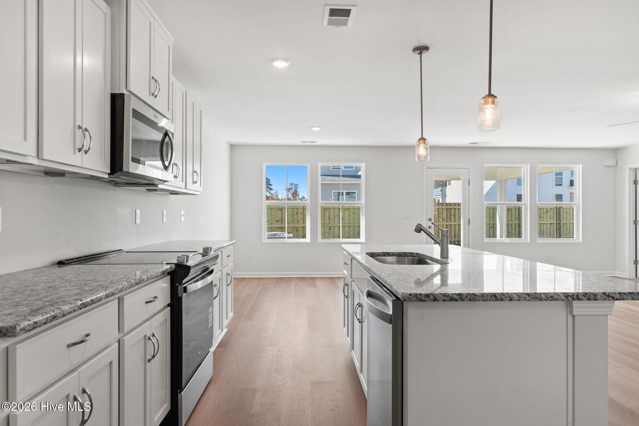 Home shown is a representation of the floor plan and may include optional features or upgrades. Elevations, materials, colors, finishes, square footage, and included features may vary from the actual home. Please consult a Sales Representative for complete details. - 770 Pelican Cove Way SE 301, Southport, NC 28461