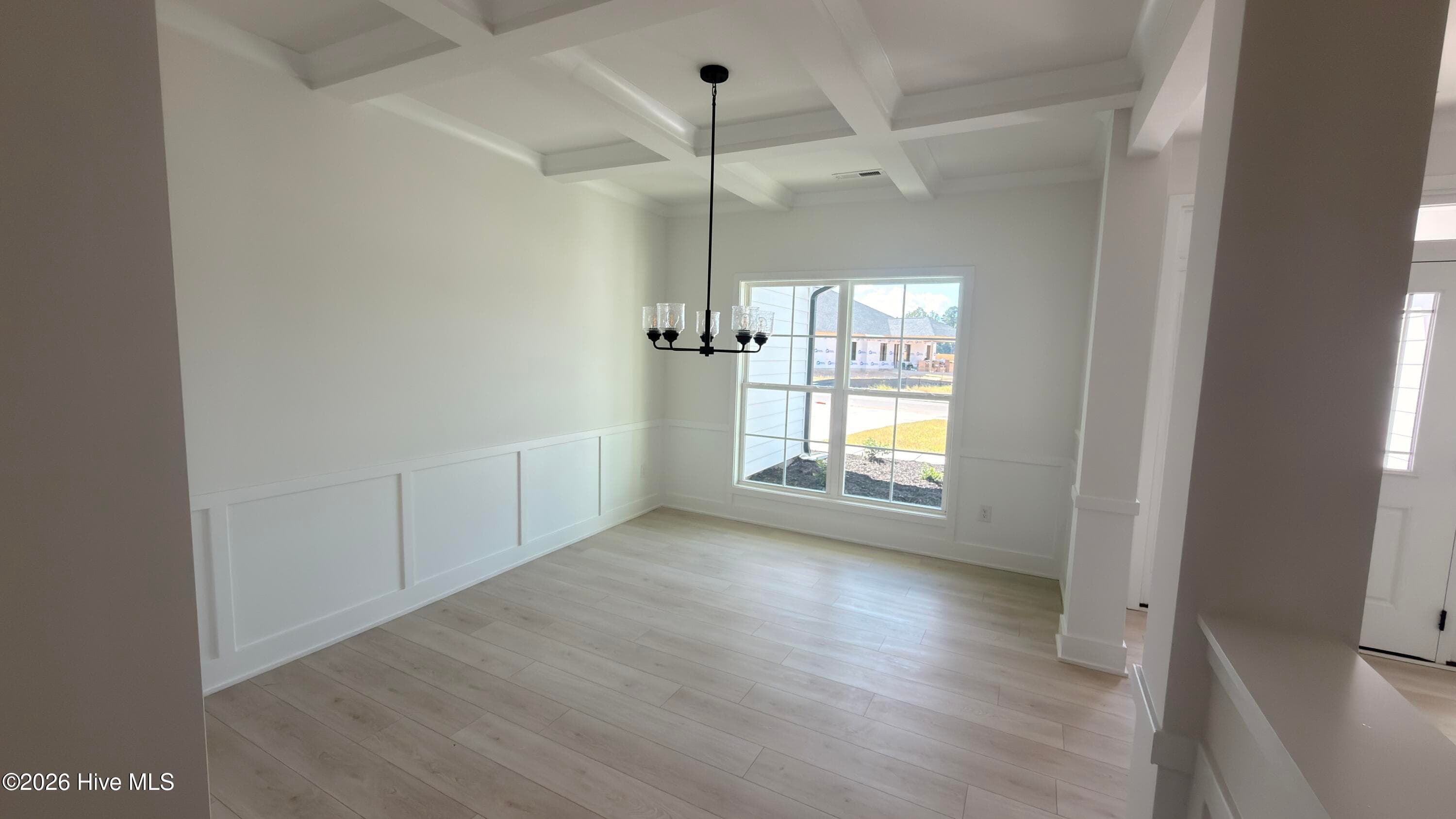 Formal dining room with coffered ceiling - 2129 Sandbrook Loop, Leland, NC 28451