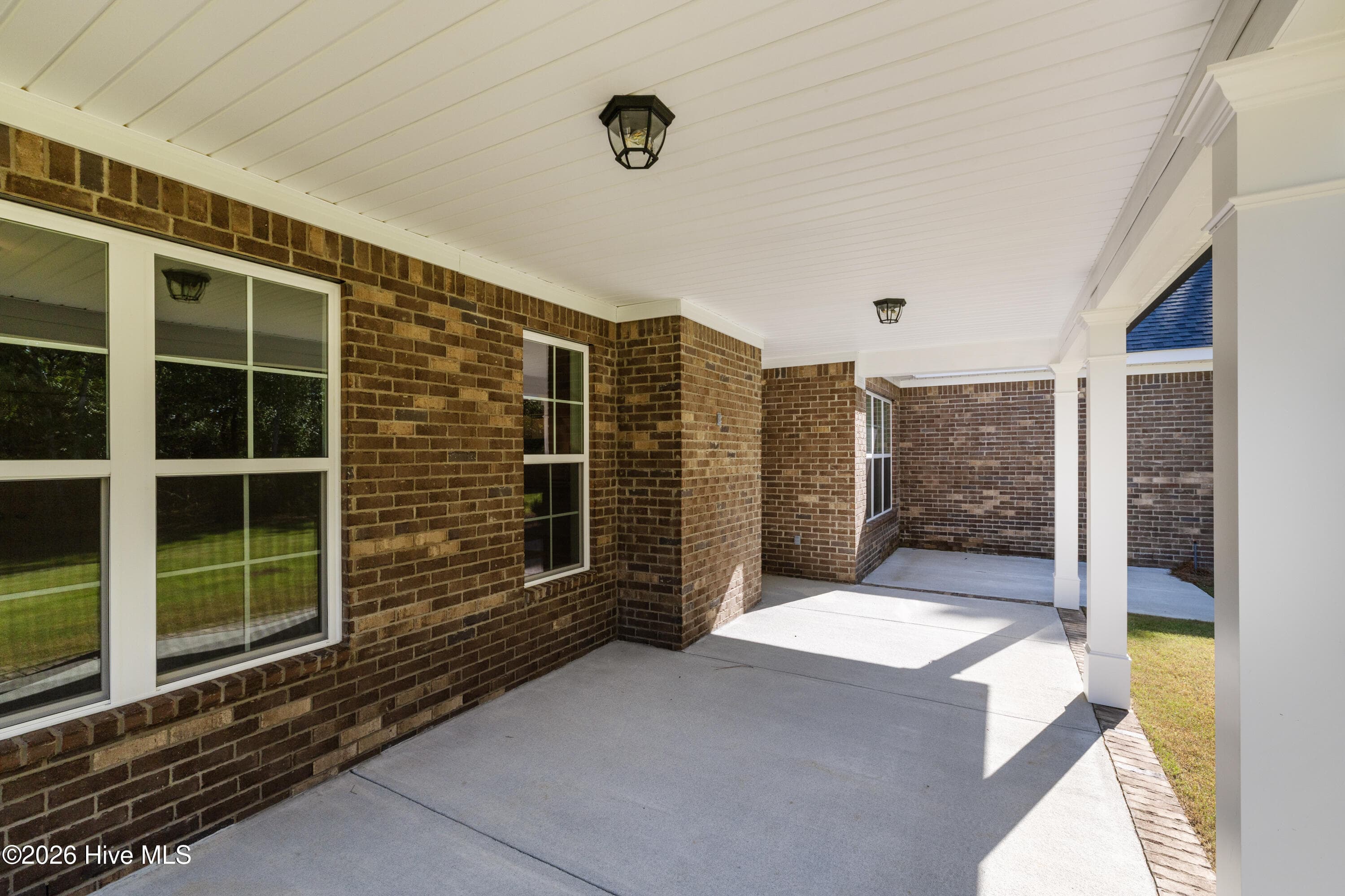 Another view of the impressive covered back porch - 458 Longshadow Drive, Aiken, SC 29803