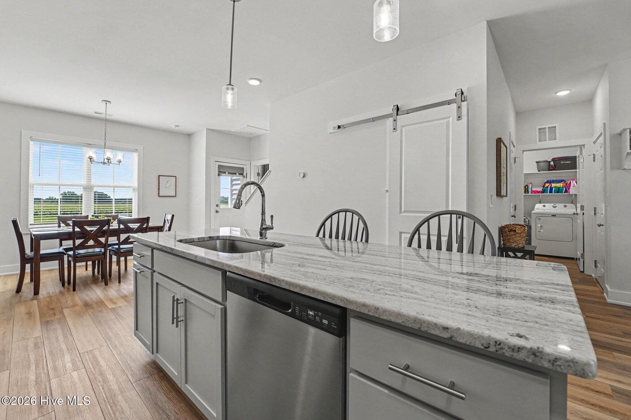 Kitchen view has a large pantry behind the barn door! - 176 Glenwood Place, Kenly, NC 27542