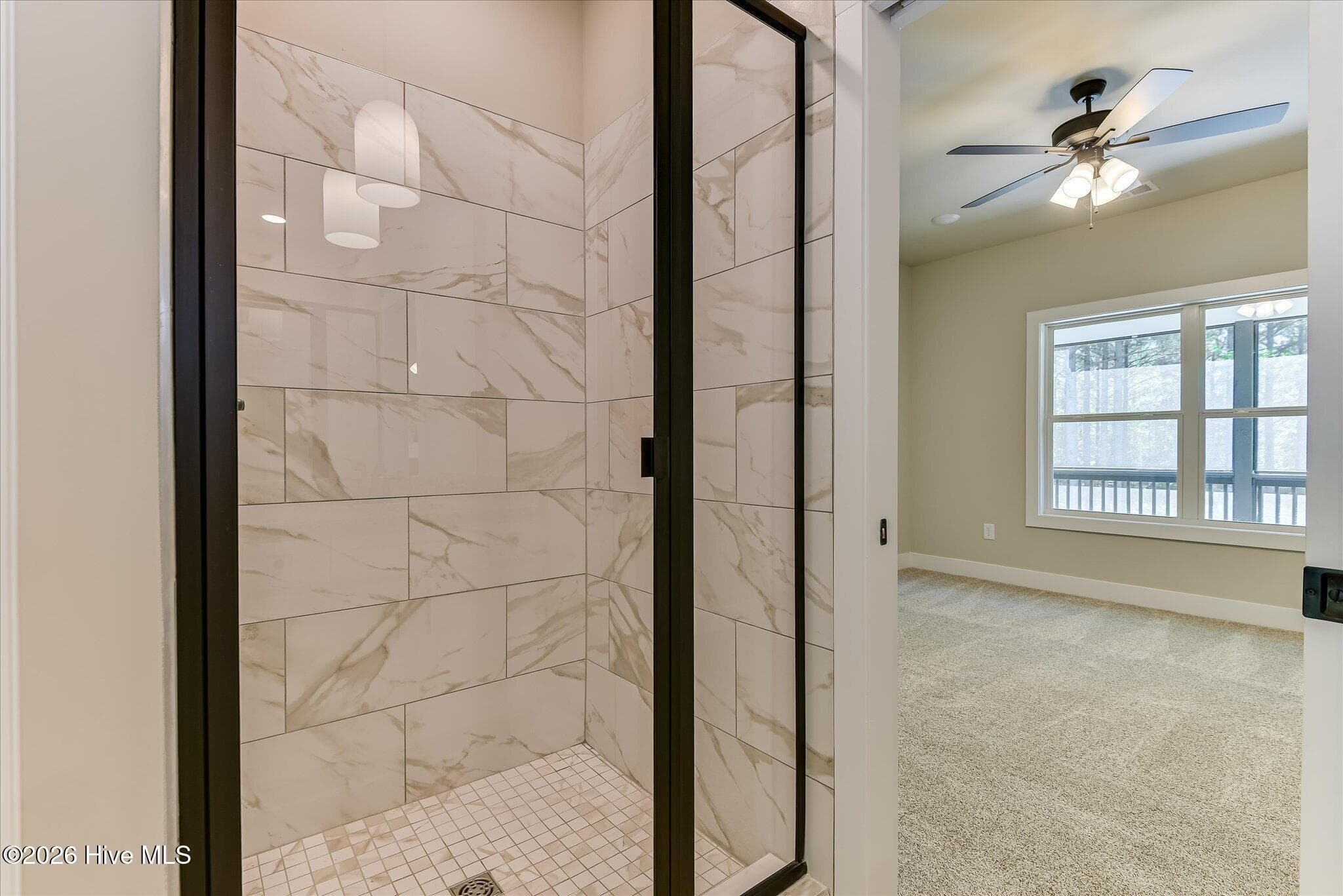 Primary Ensuite with double-sink vanity, tile shower, large walk-in closet - 1198 Sunset Cove, Tignall, GA 30668