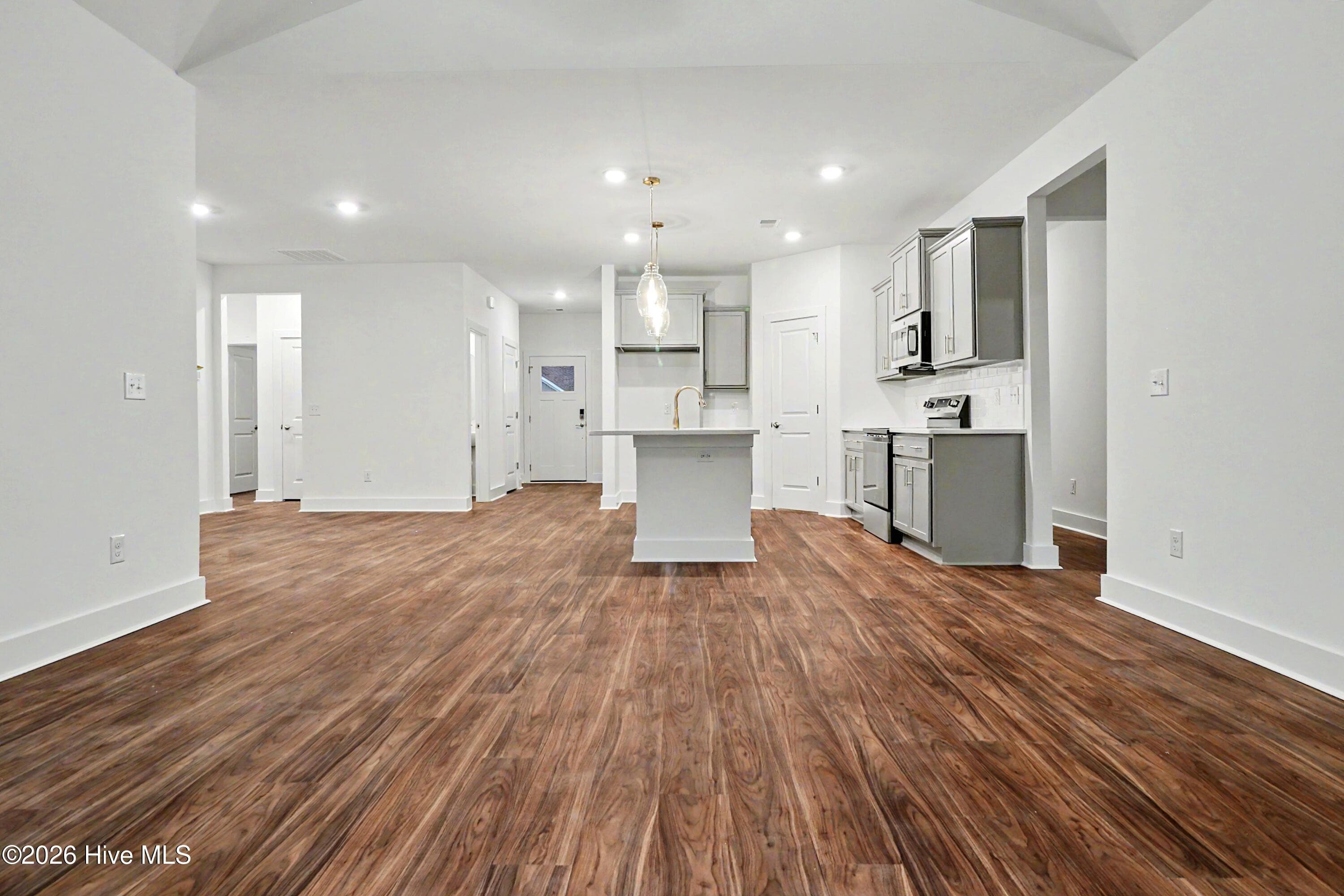 Great Room with Vaulted Ceiling looking into Kitchen and Dining - 2114 Cregan Cove SW (Lot 3), Ocean Isle Beach, NC 28469