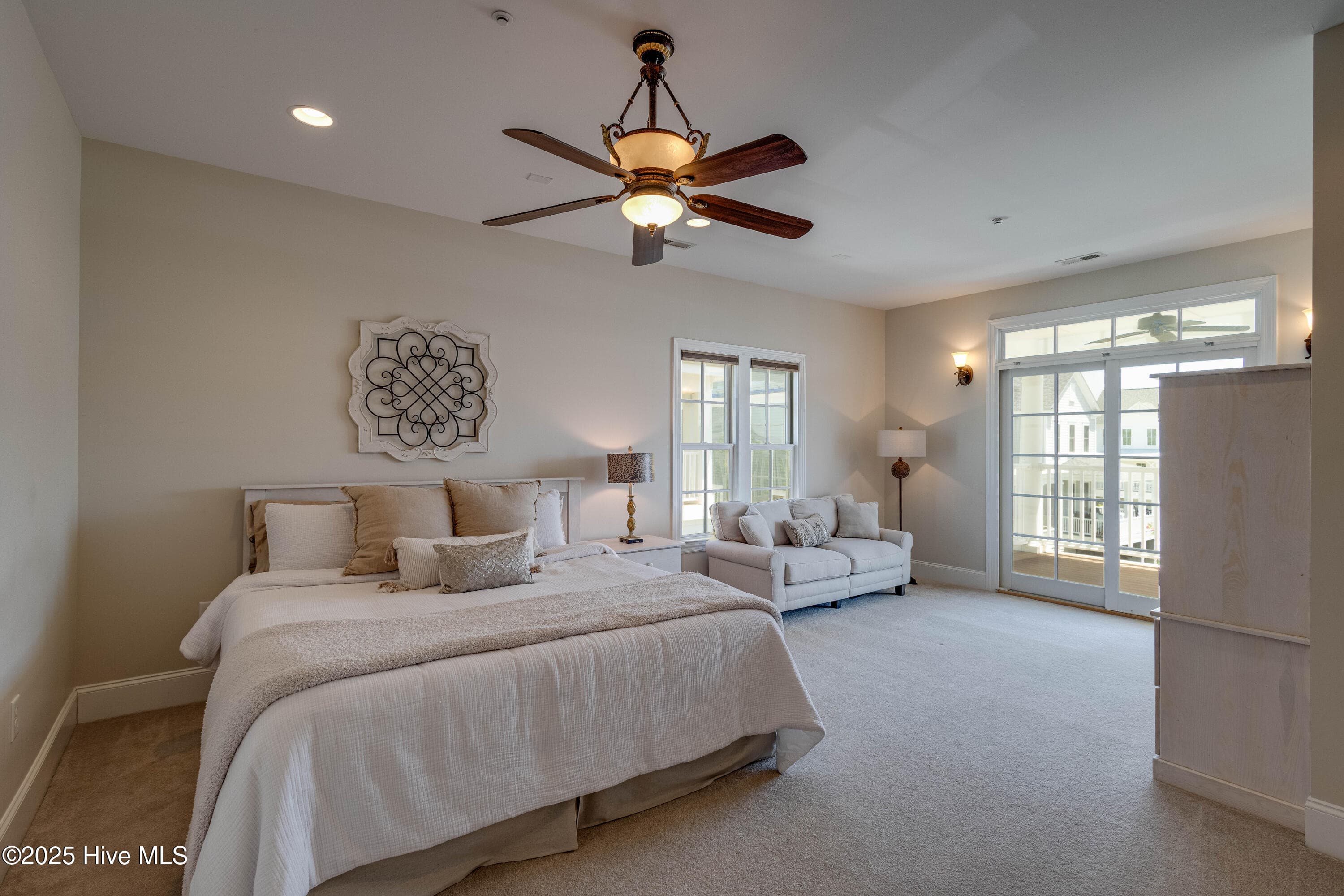 Large Primary Bedroom with addition sitting area and private covered balcony with a view of the Pamlico. - 207 S Academy Street, Washington, NC 27889