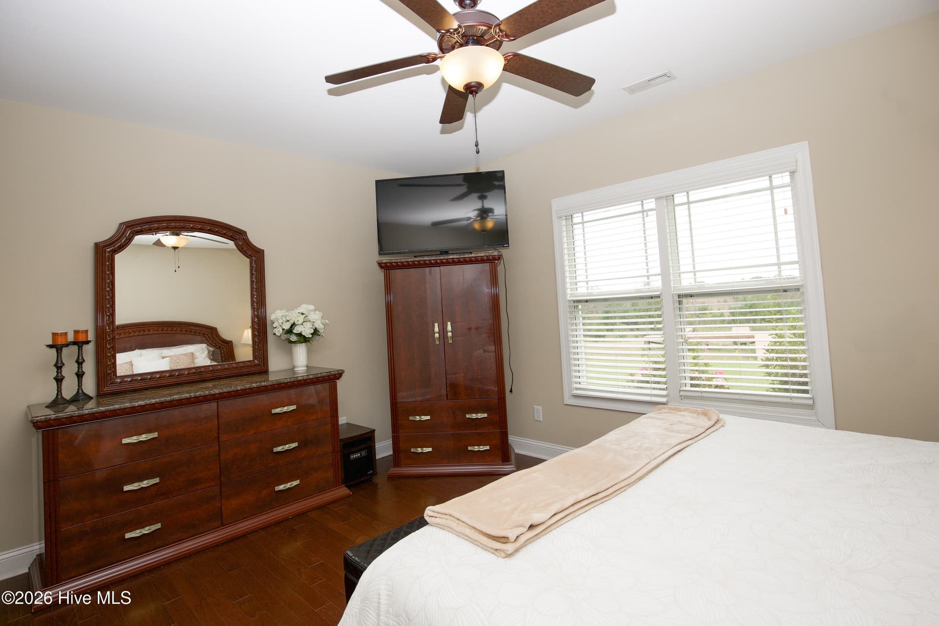 Lower-level bedroom with room for a dresser and armoire. - 899 Seagull Drive, Vass, NC 28394