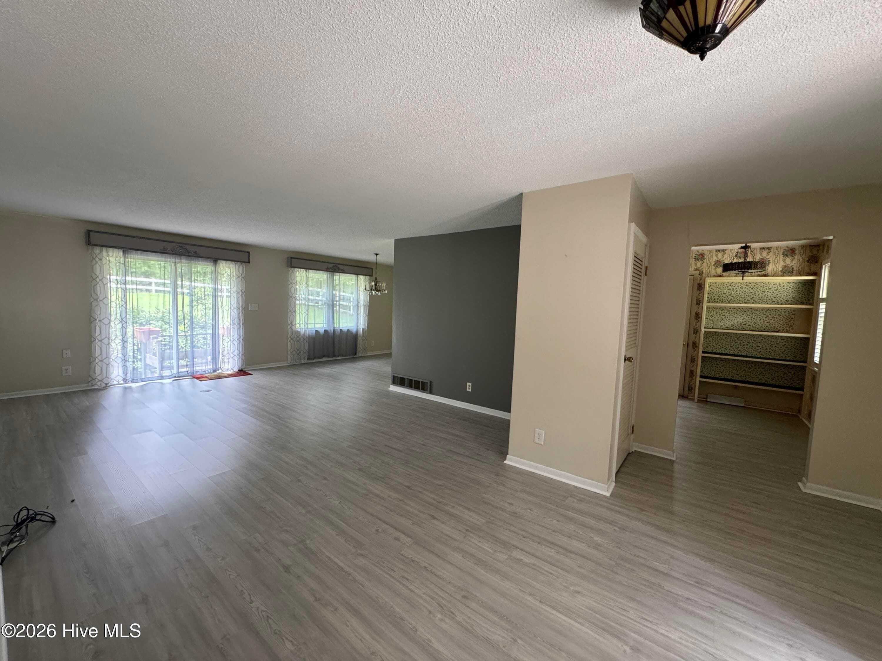 View from Front Door into the Living room and Dining Room with slight view of Kitchen on the right. - 118 Oakwood Drive, Havelock, NC 28532
