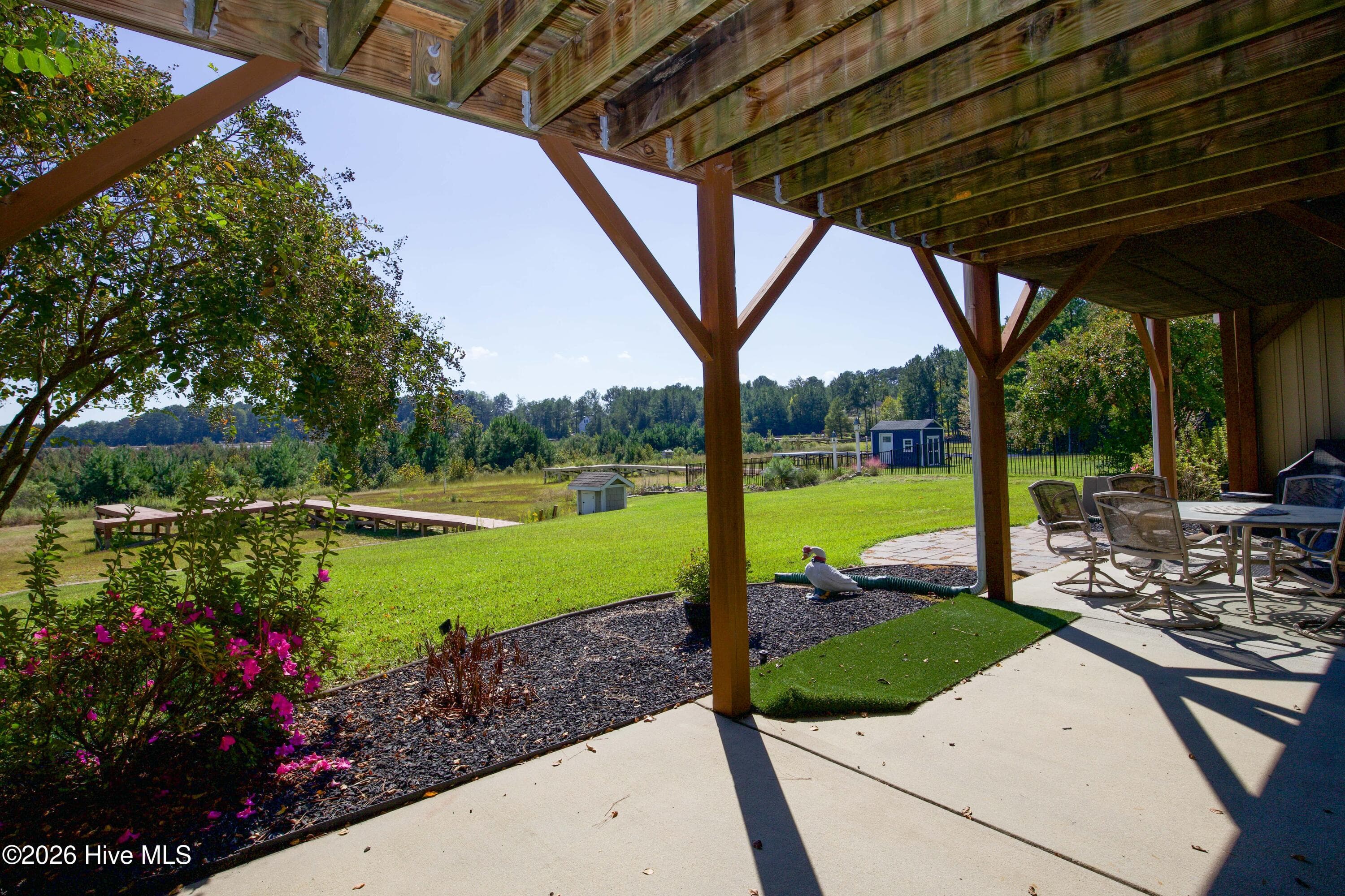 Lower patio at 899 Seagull Drive looking toward the existing dock and dry lakebed in Woodlake, Vass NC. - 899 Seagull Drive, Vass, NC 28394, Vass