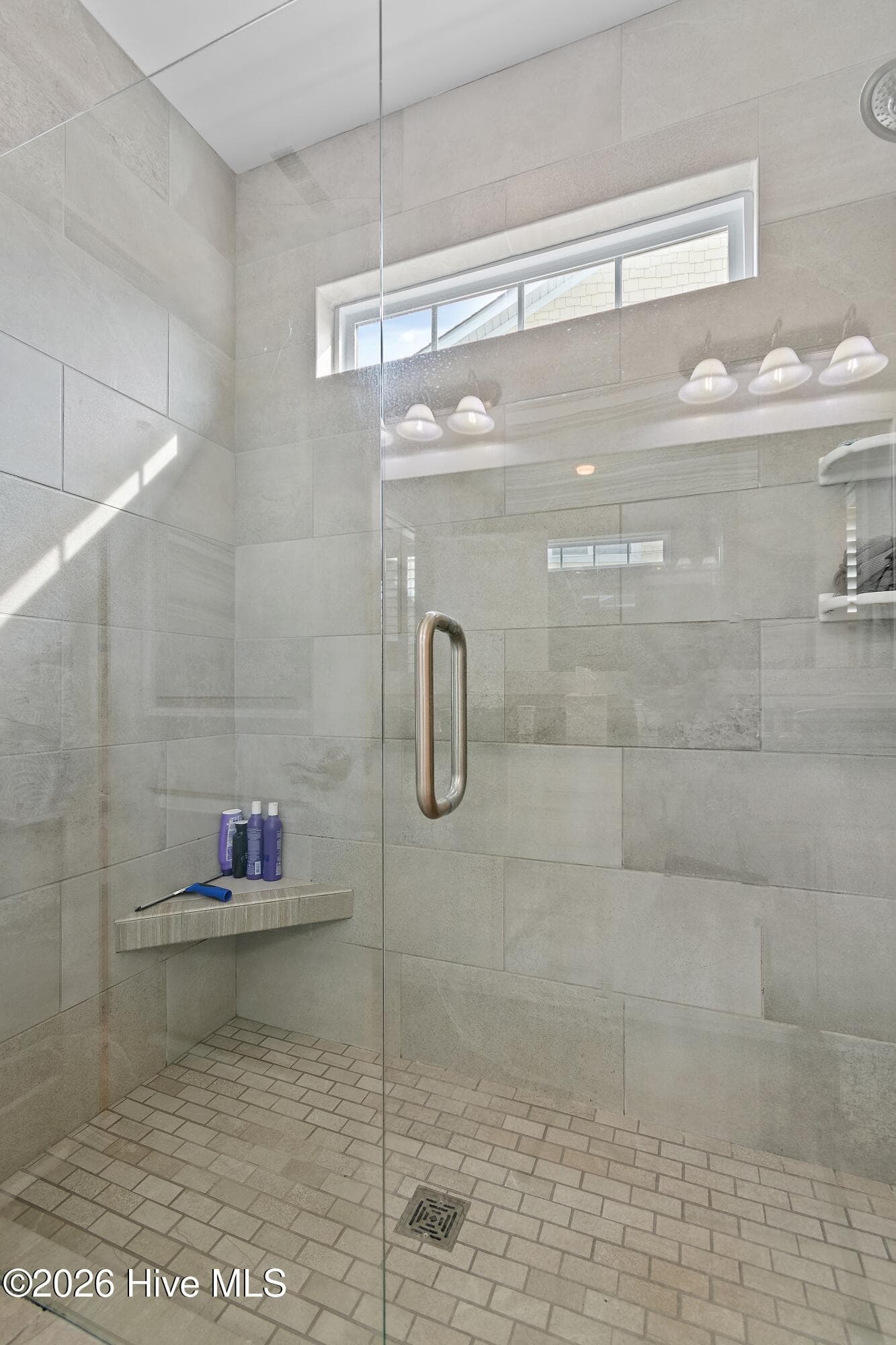 Full tile shower in primary bathroom. - 6358 Bryson Drive SW, Ocean Isle Beach, NC 28469