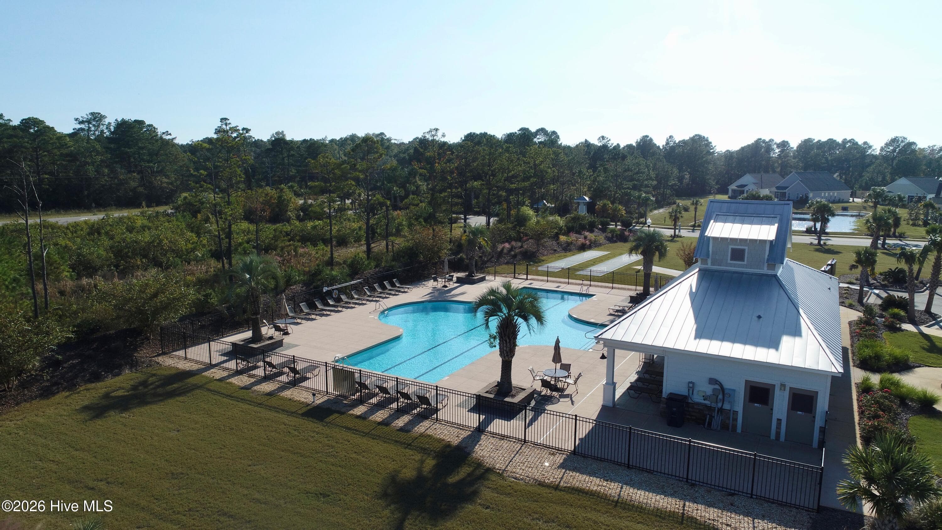 Community pool and clubhouse. - 6358 Bryson Drive SW, Ocean Isle Beach, NC 28469